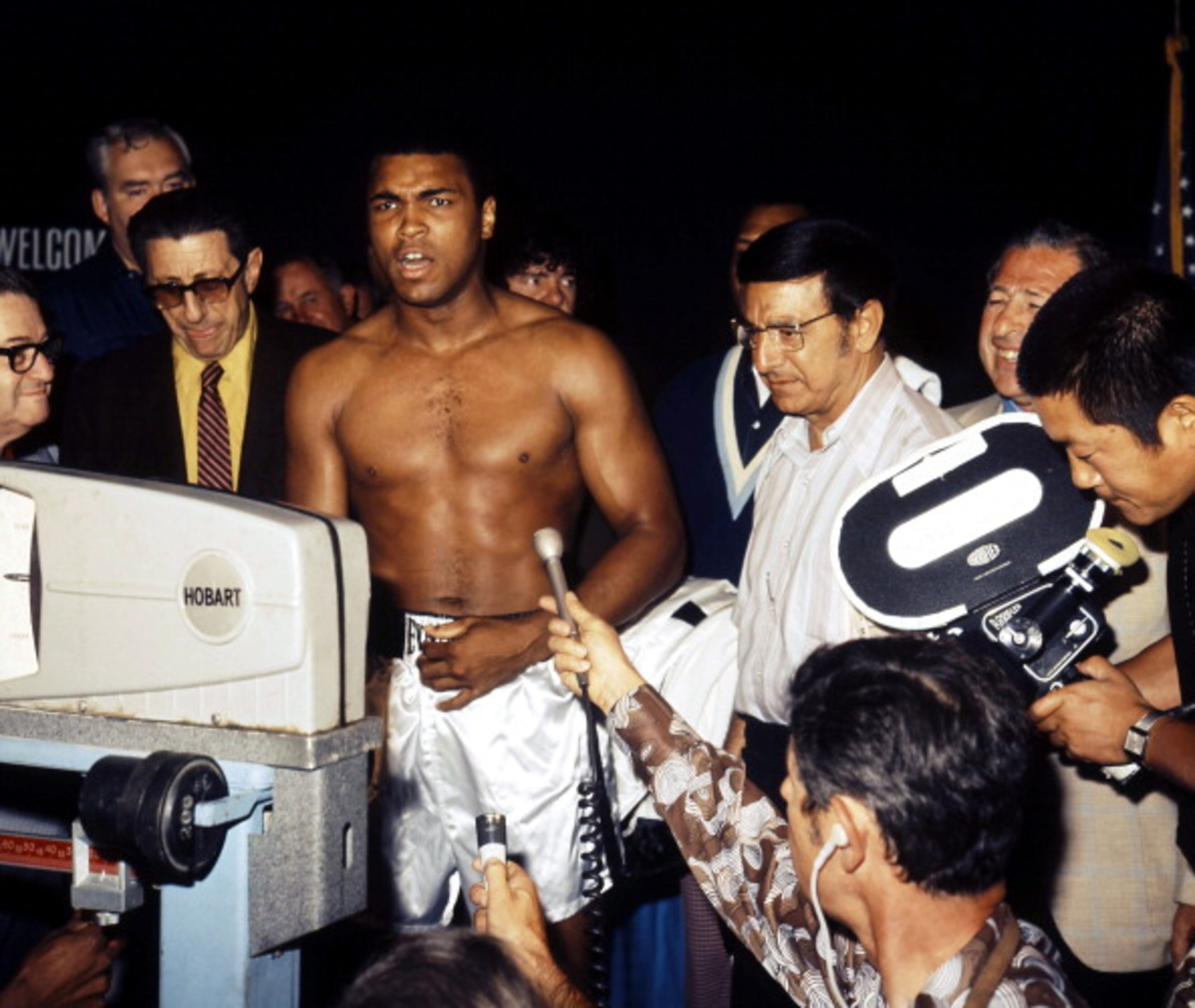 LAS VEGAS - JUNE 27,1972: Muhammad Ali gets weighed during a press conference before his fight against Jerry Quarry at the Convention Center, Las Vegas, Nevada. Muhammad Ali won the NABF heavyweight title by a TKO 7. (Photo by: The Ring Magazine/Getty Images)