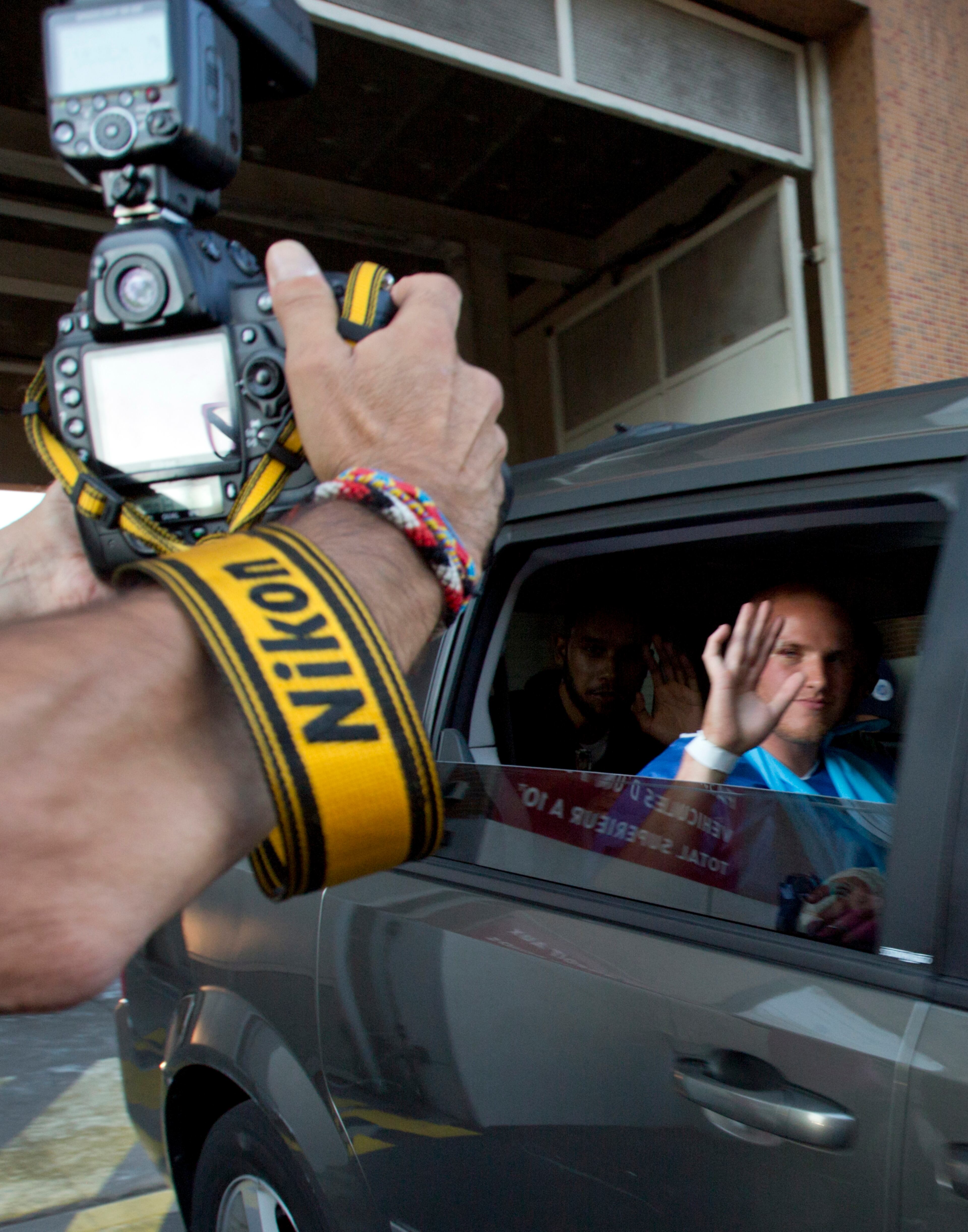 U.S. Spencer Stone waves as he leaves the police station in Arras, northern France, Saturday, Aug. 22, 2015. A gunman prepared to open fire with an automatic weapon on a high-speed train traveling from Amsterdam to Paris Friday, wounding several people before being subdued by passengers, officials said. Spencer Stone is one of the passengers credited with subduing the gunman. (AP Photo/Virginia Mayo)