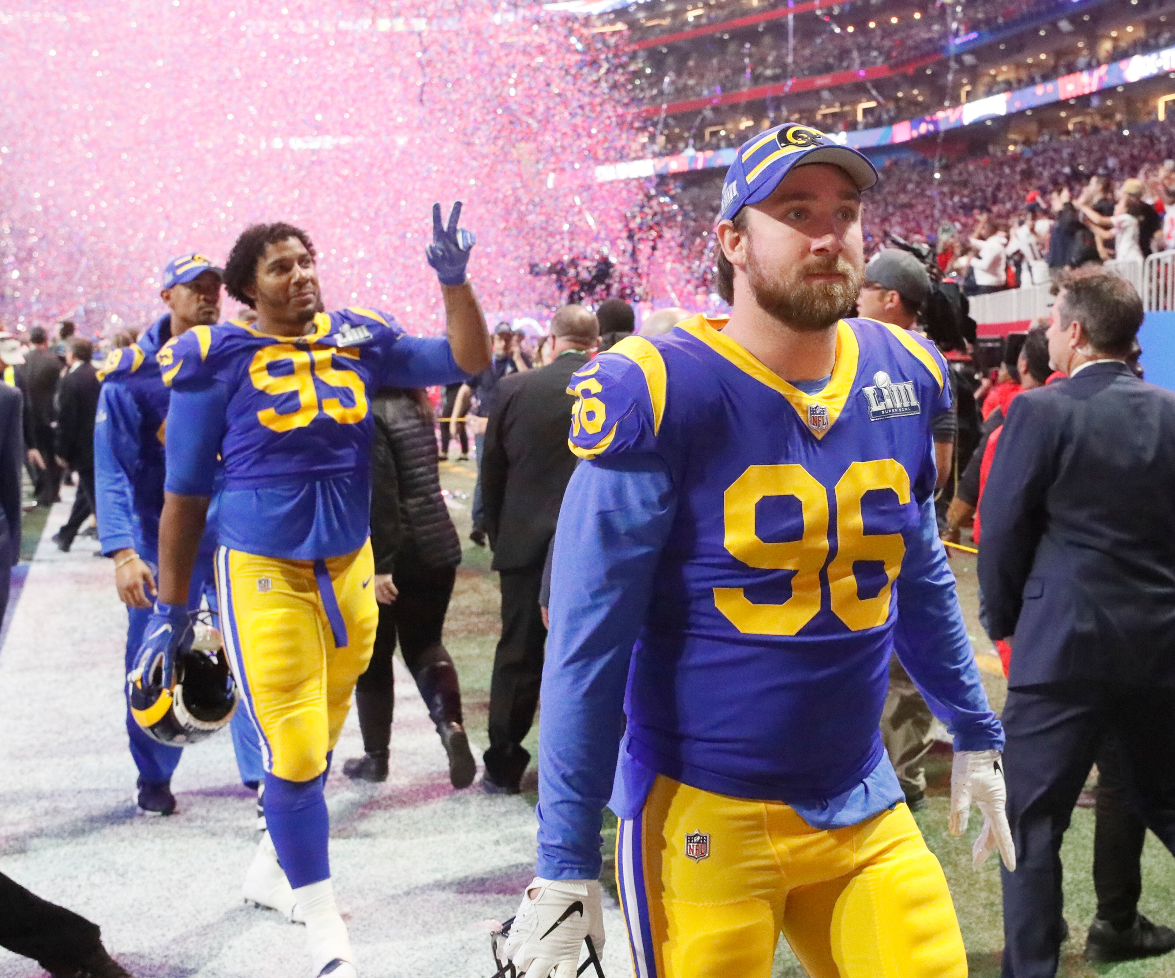 2/3/19 - Atlanta - Los Angeles Rams outside linebacker Matt Longacre (96) and Los Angeles Rams defensive tackle Ethan Westbrooks (95) walk off after the loss to the New England Patriots in Super Bowl LIII on Sunday, Feb. 3, 2019 at Mercedes-Benz Stadium in Atlanta, Ga. Bob Andres / bandres@ajc.com