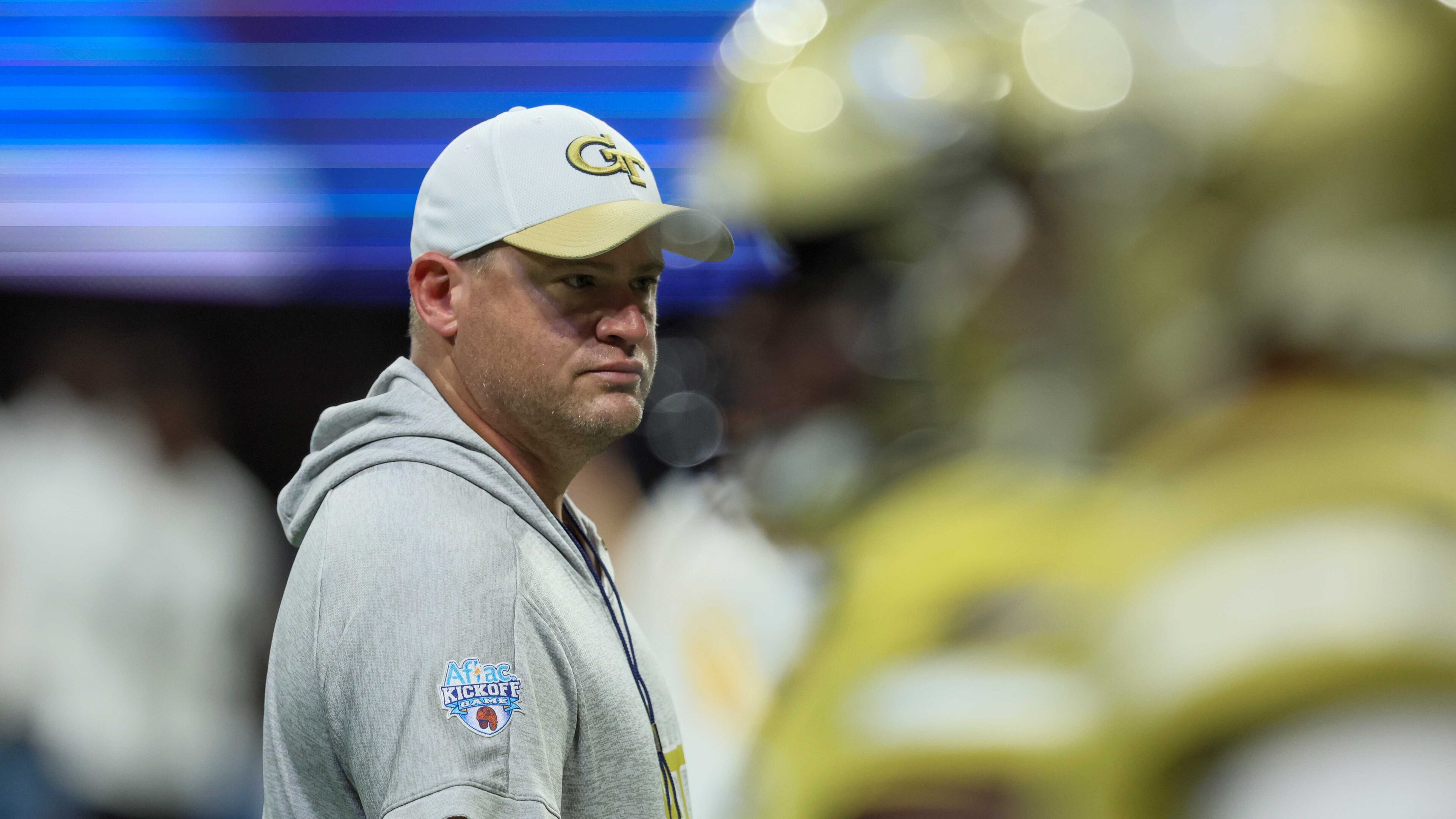 Georgia Tech coach Brent Key watches players warm up before their game against Louisville in the Aflac Kickoff Game at Mercedes-Benz Stadium, Friday, September 1, 2023, in Atlanta. (Jason Getz / Jason.Getz@ajc.com)