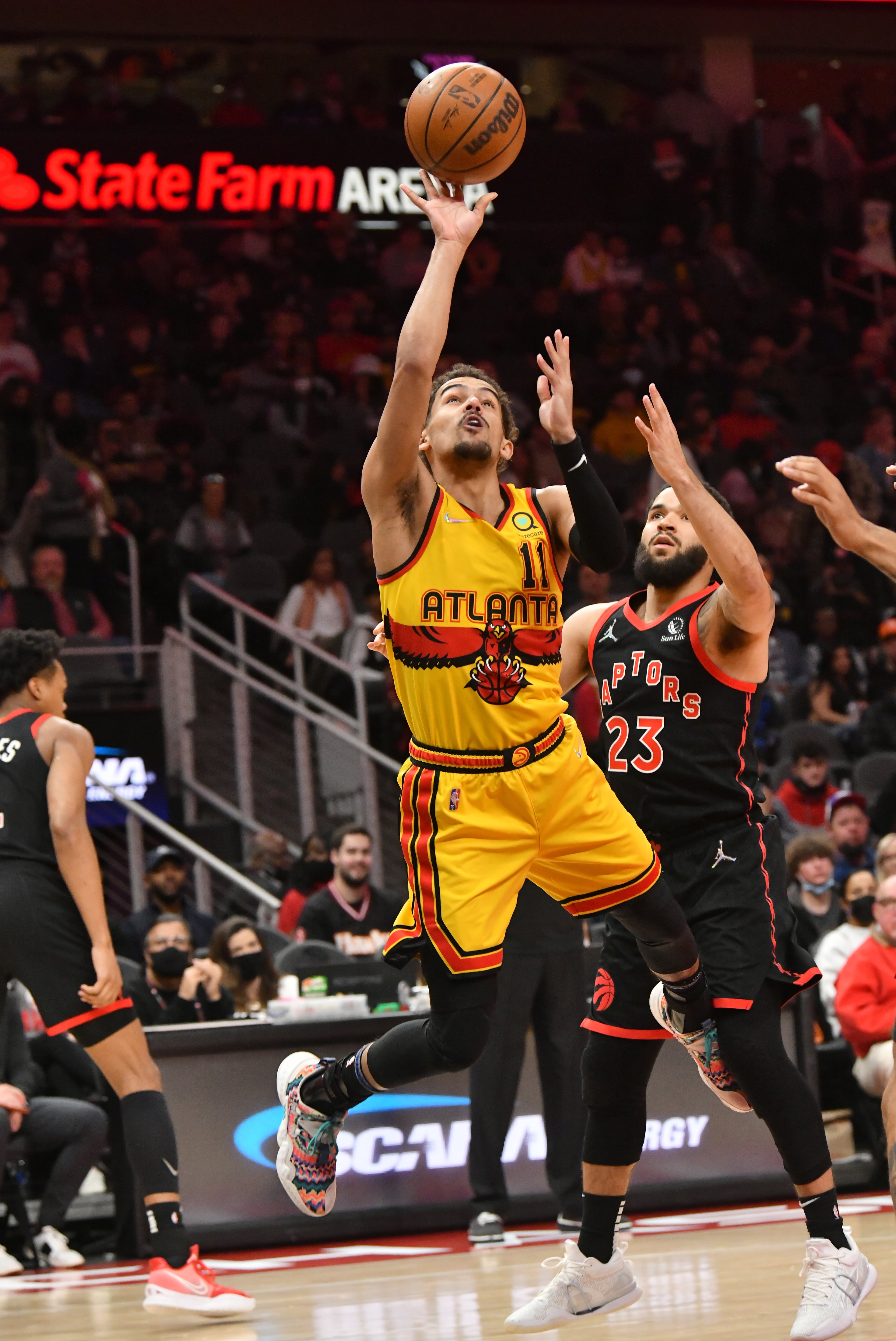 Atlanta Hawks guard Trae Young (11) goes up for a shot during the first half against the Raptors at State Farm Arena on Saturday, February 26, 2022. (Hyosub Shin / Hyosub.Shin@ajc.com)