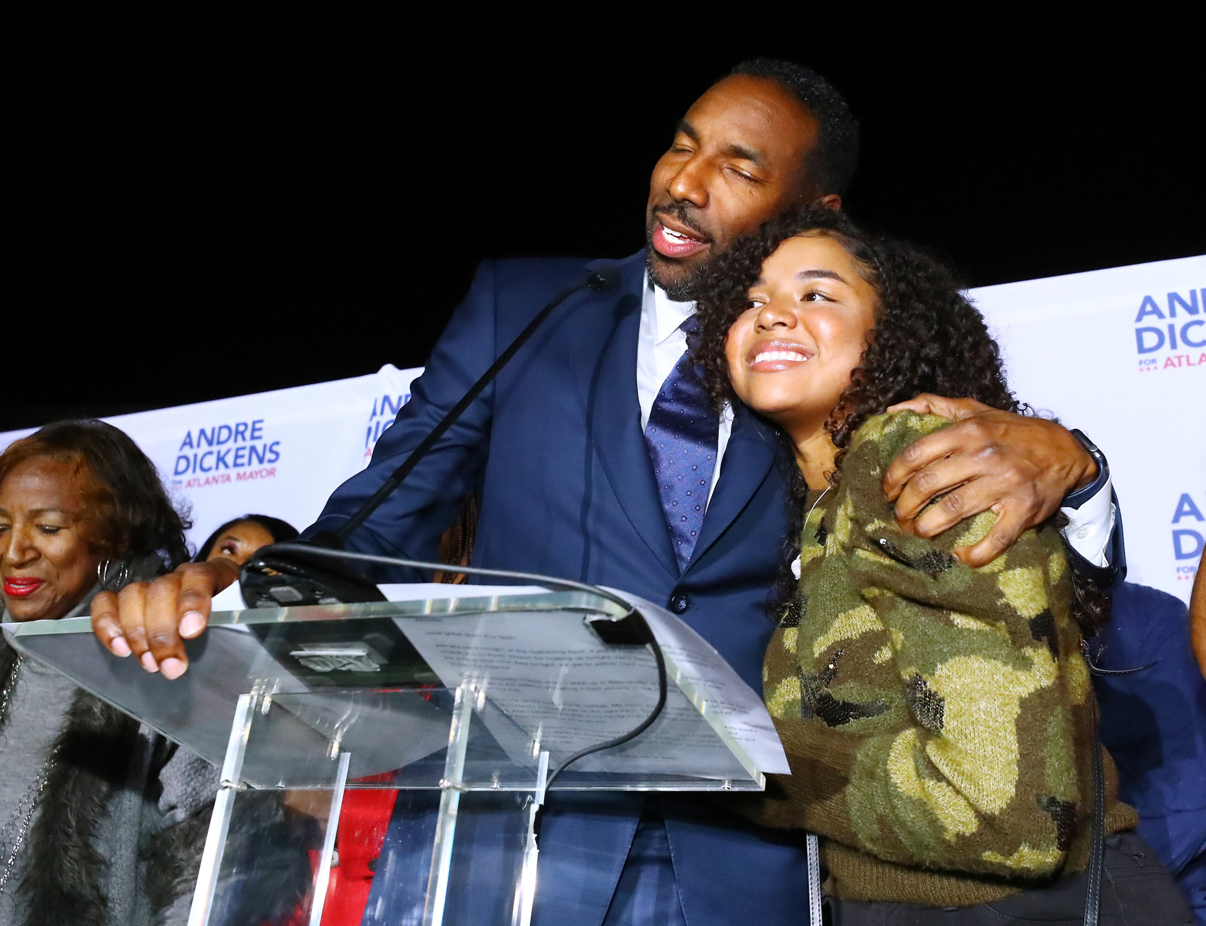 113021 Atlanta: Atlanta Mayor-elect Andre Dickens gives his daughter Bailey a hug during his victory address at his election night watch party on Tuesday, Nov. 30, 2021, at the Gathering Spot in Atlanta. “Curtis Compton / Curtis.Compton@ajc.com”`