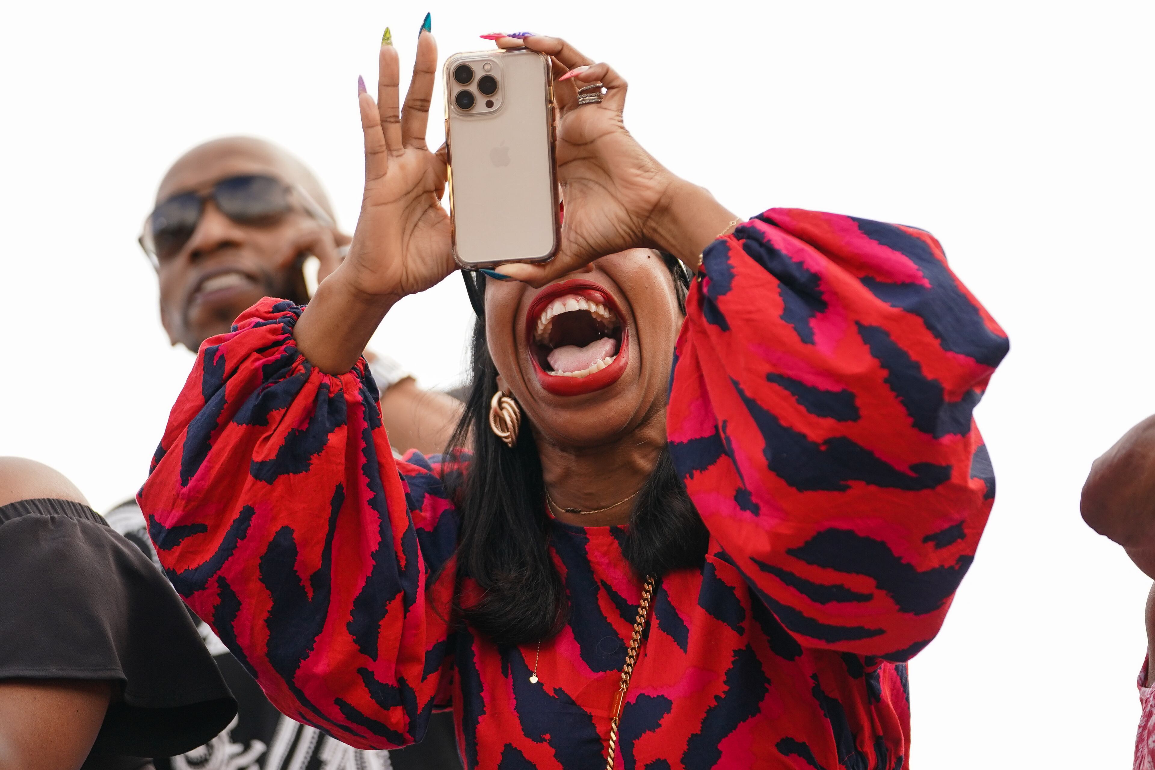 An attendee shows her excitement during Clark Atlanta University’s 33rd Commencement Exercises, at Panther Stadium on Saturday, May 14, 2022, in Atlanta. (Elijah Nouvelage for The Atlanta Journal-Constitution)