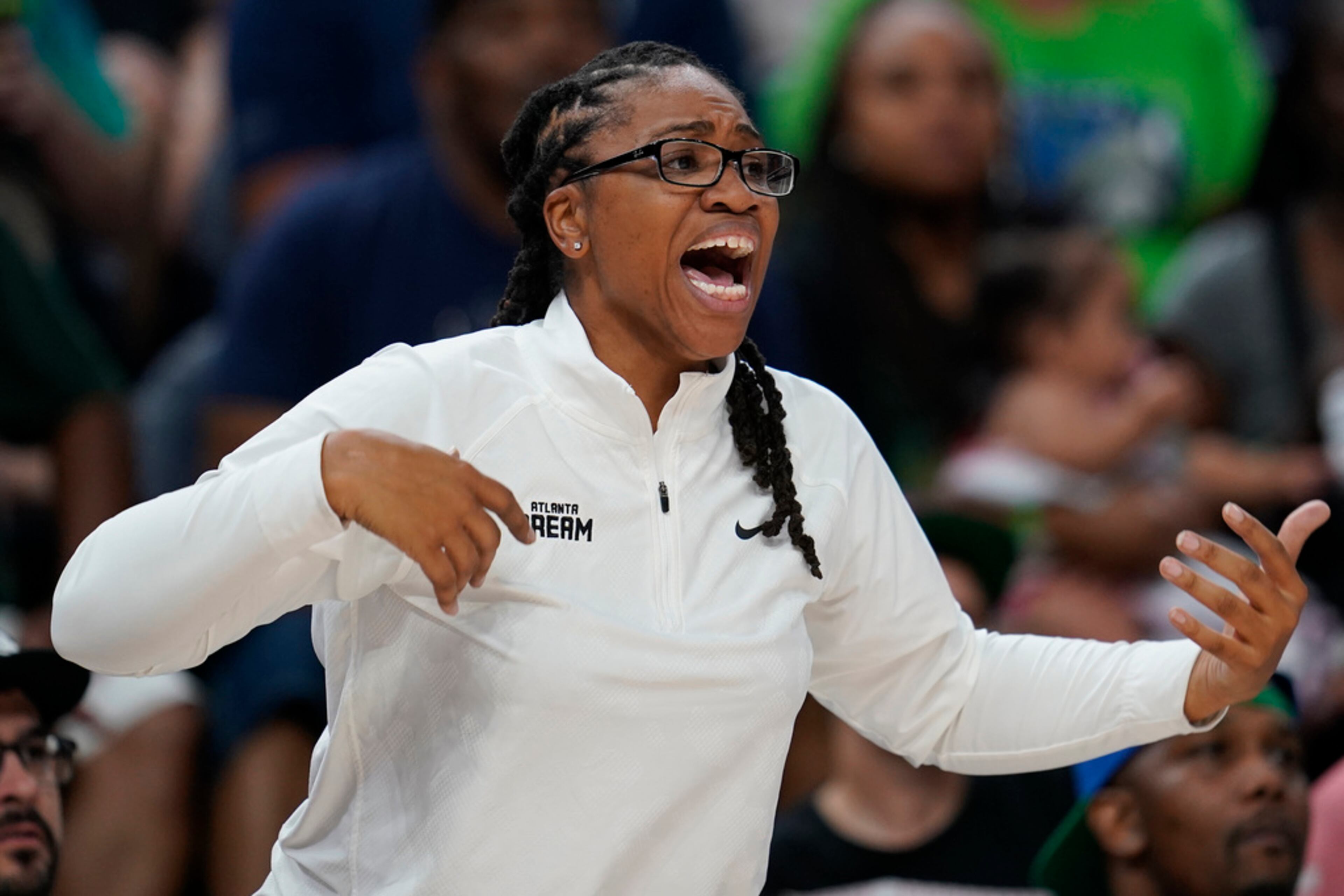 Atlanta Dream head coach Tanisha Wright reacts during the second half of a WNBA basketball game against the Minnesota Lynx, Friday, Sept. 1, 2023, in Minneapolis. The Dream lost 91-85. (AP Photo/Abbie Parr)