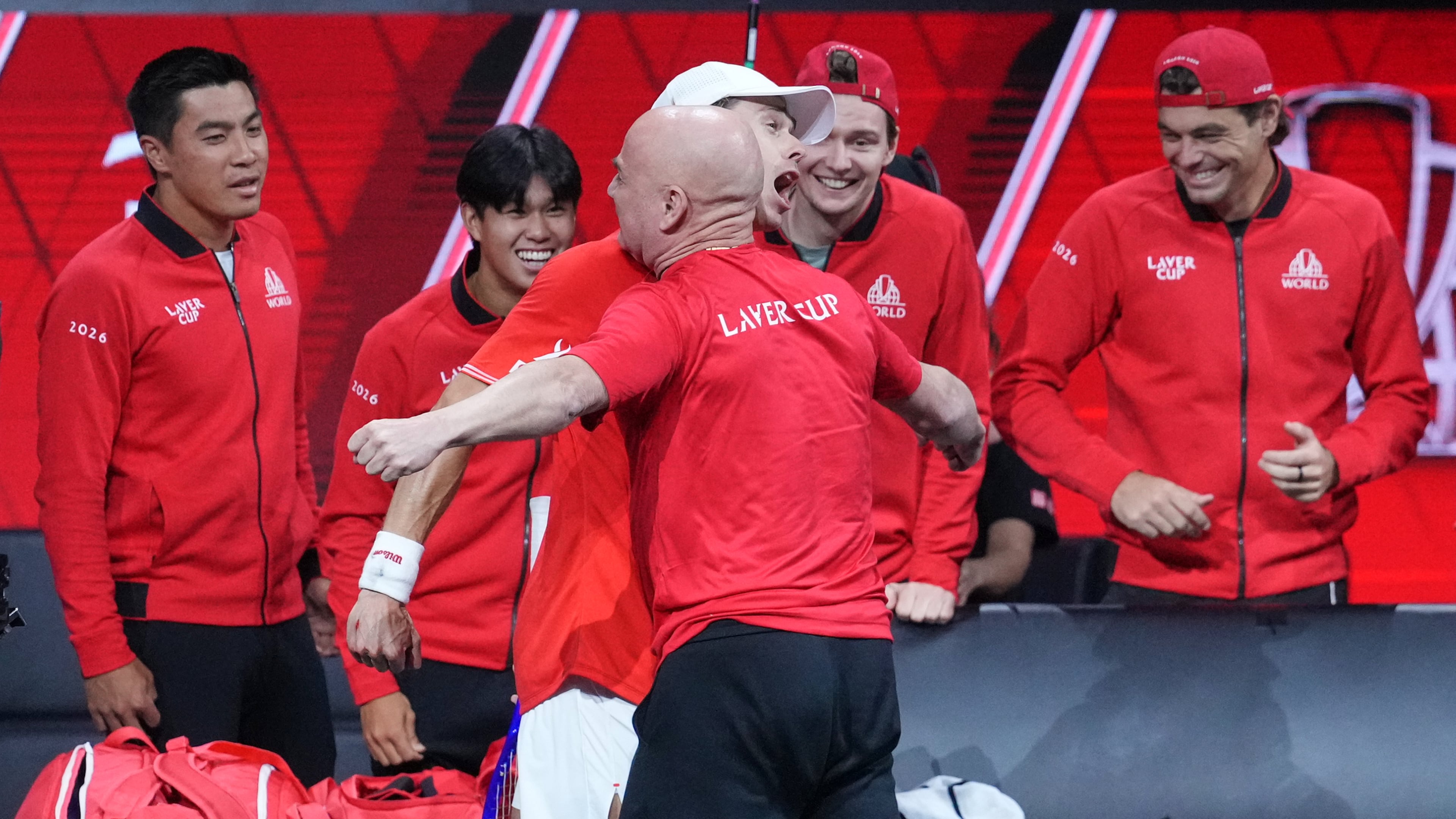 Team World's Alex De Minaur celebrates with Team World captain Andre Agassi after beating Team Europe's Alexander Zverev in a Laver Cup tennis tournament match in London, Saturday, Sept. 26, 2026. (AP Photo/Maja Smiejkowska)