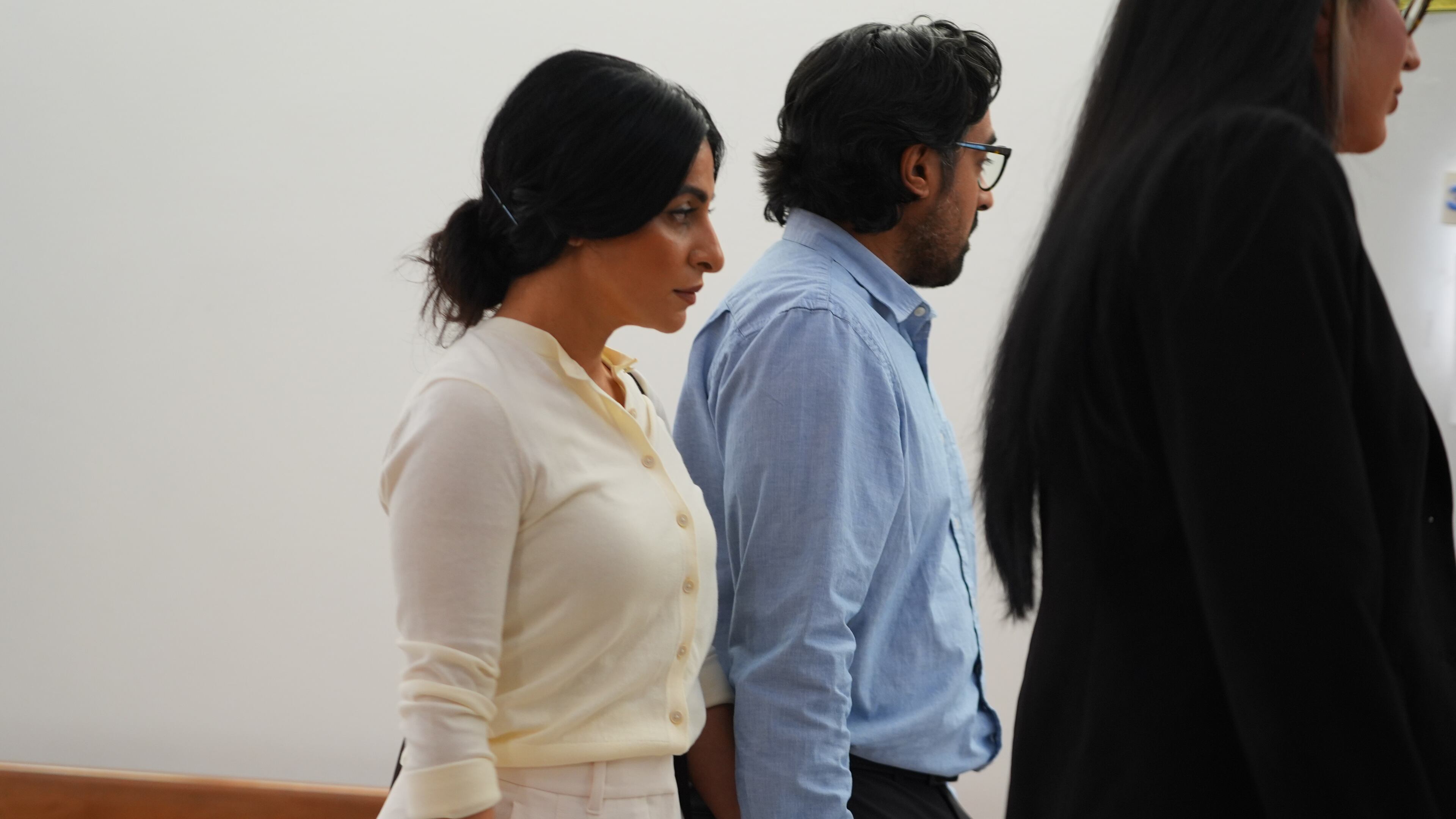 Nausheen Gilkar, left, and her husband Omar Ahmed arrive for a court hearing in Dallas, Tuesday, Aug. 25, 2026. (AP Photo/LM Otero)