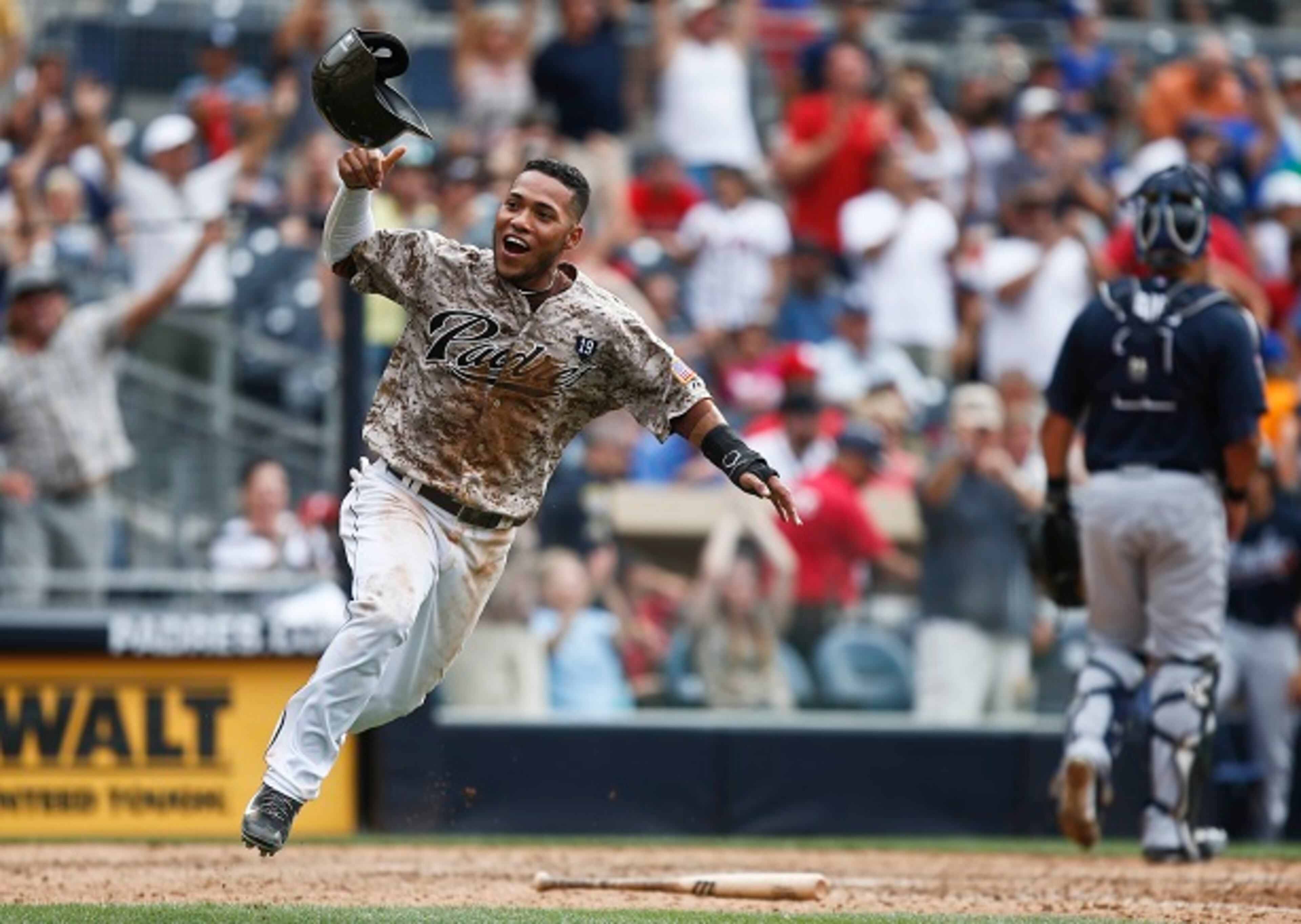 San Diego Padres' Alexi Amarista throws his helmet in the air as he scores the game-winning run on a single by Everth Cabrera in the 10th inning of a baseball game against the Atlanta Braves, Sunday, Aug. 3, 2014, in San Diego. San Diego won 4-3. (AP Photo/Lenny Ignelzi) Can't camouflage this: The Braves are in real trouble. (Lenny Ignelzi/AP)