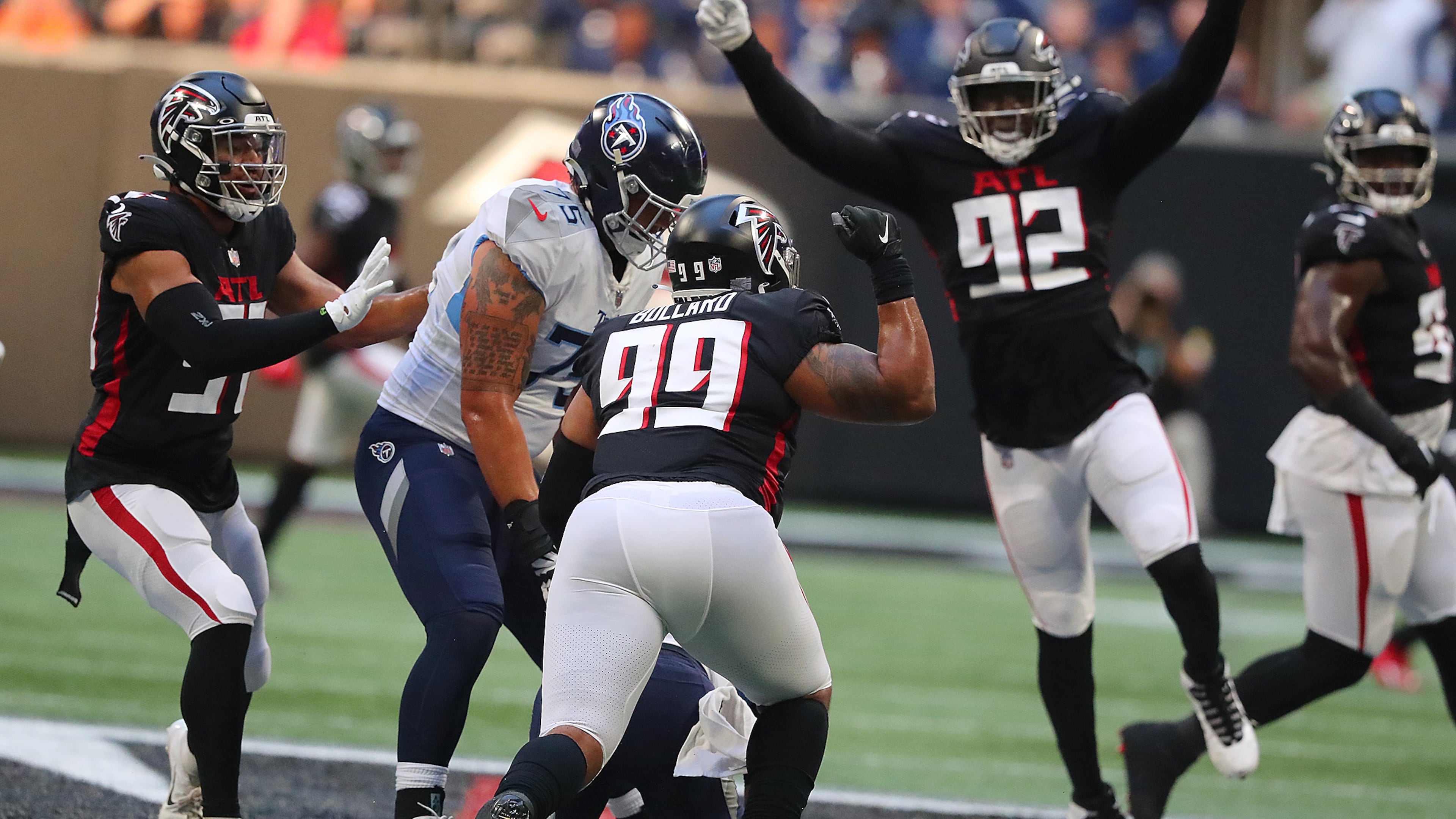 081321 Atlanta: Atlanta Falcons defensive lineman Jonathan Bullard (center) celebrates sacking Tennessee Titans quarterback Logan Woodside with Adetokunbo Ogundeji right and the rest of the defense during the first quarter of a NFL preseason football game on Friday, August 13, 2021, in Atlanta. “Curtis Compton / Curtis.Compton@ajc.com”