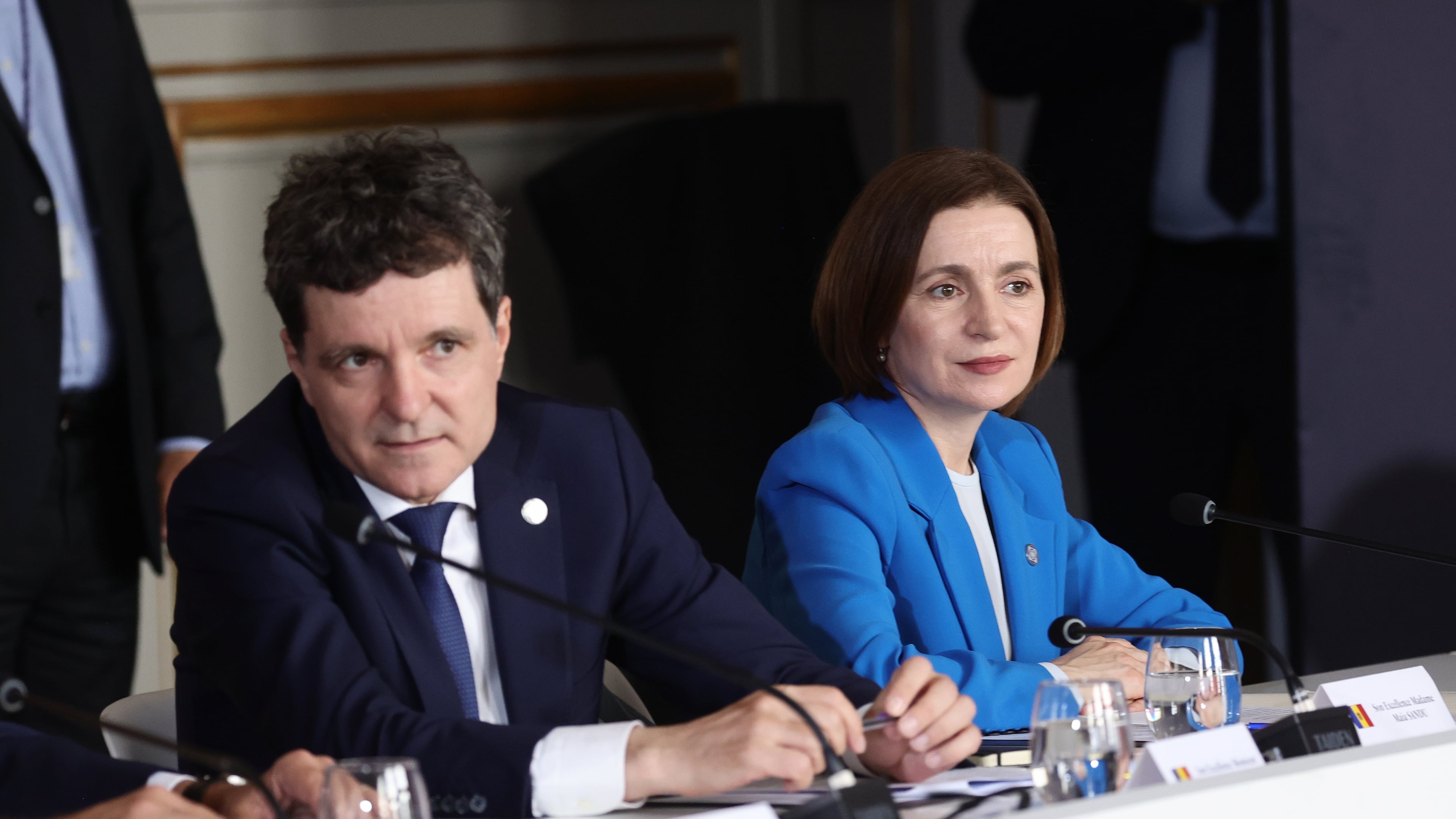 Romanian President Nicusor Dan, left, and Moldovan President Maia Sandu attend the Coalition of the Willing summit on security guarantees for Ukraine, at the Hotel des Invalides in Paris, Monday, July 2026. (Teresa Suares/Pool Photo via AP)