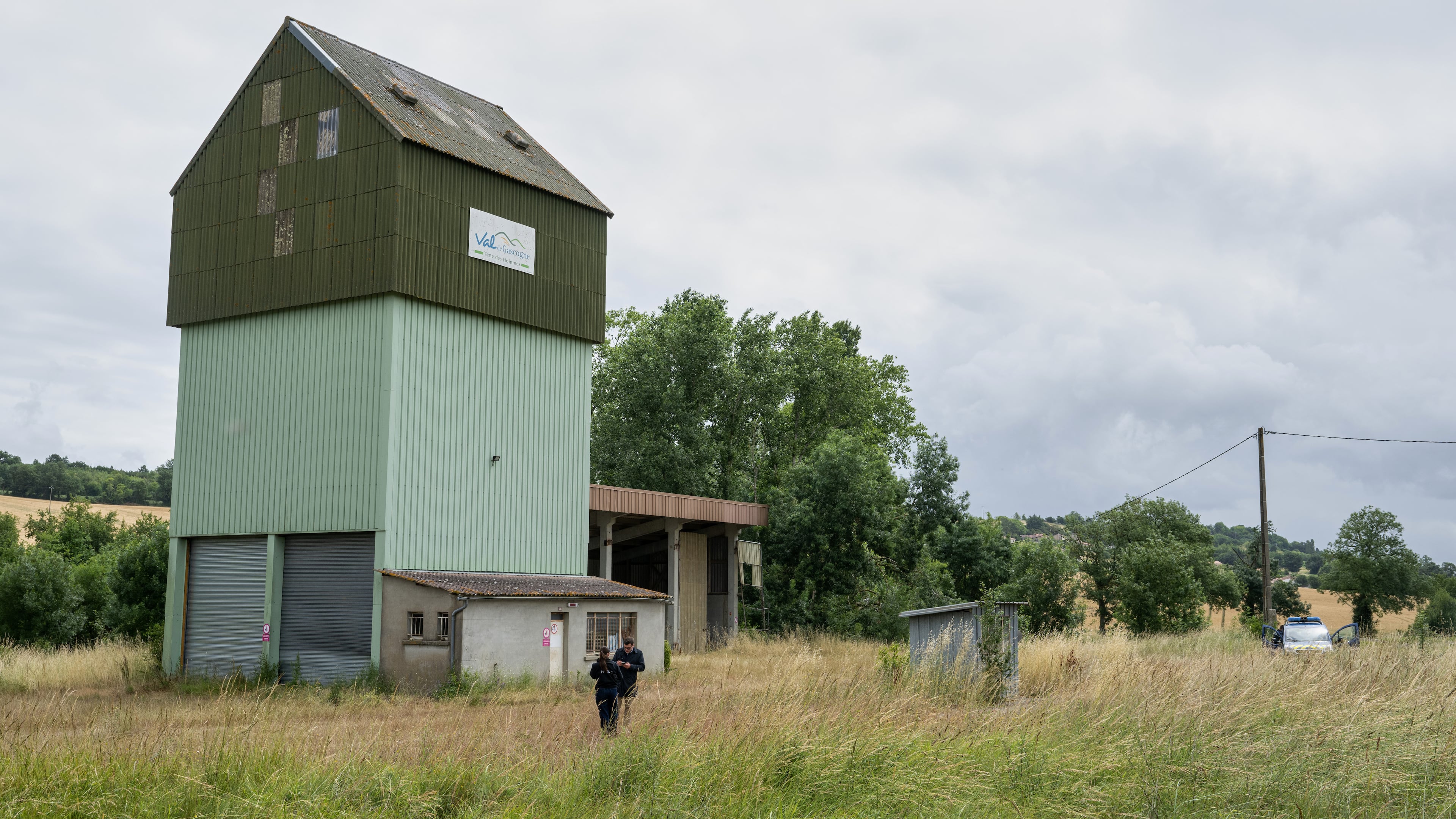 French police guard a farm silo where a body was found yesterday during the search to find missing 11 year-old girl Lyhanna in Puycasquier, southwestern France, Friday, June,5, 2026. (AP Photo/Frederic Lancelot)