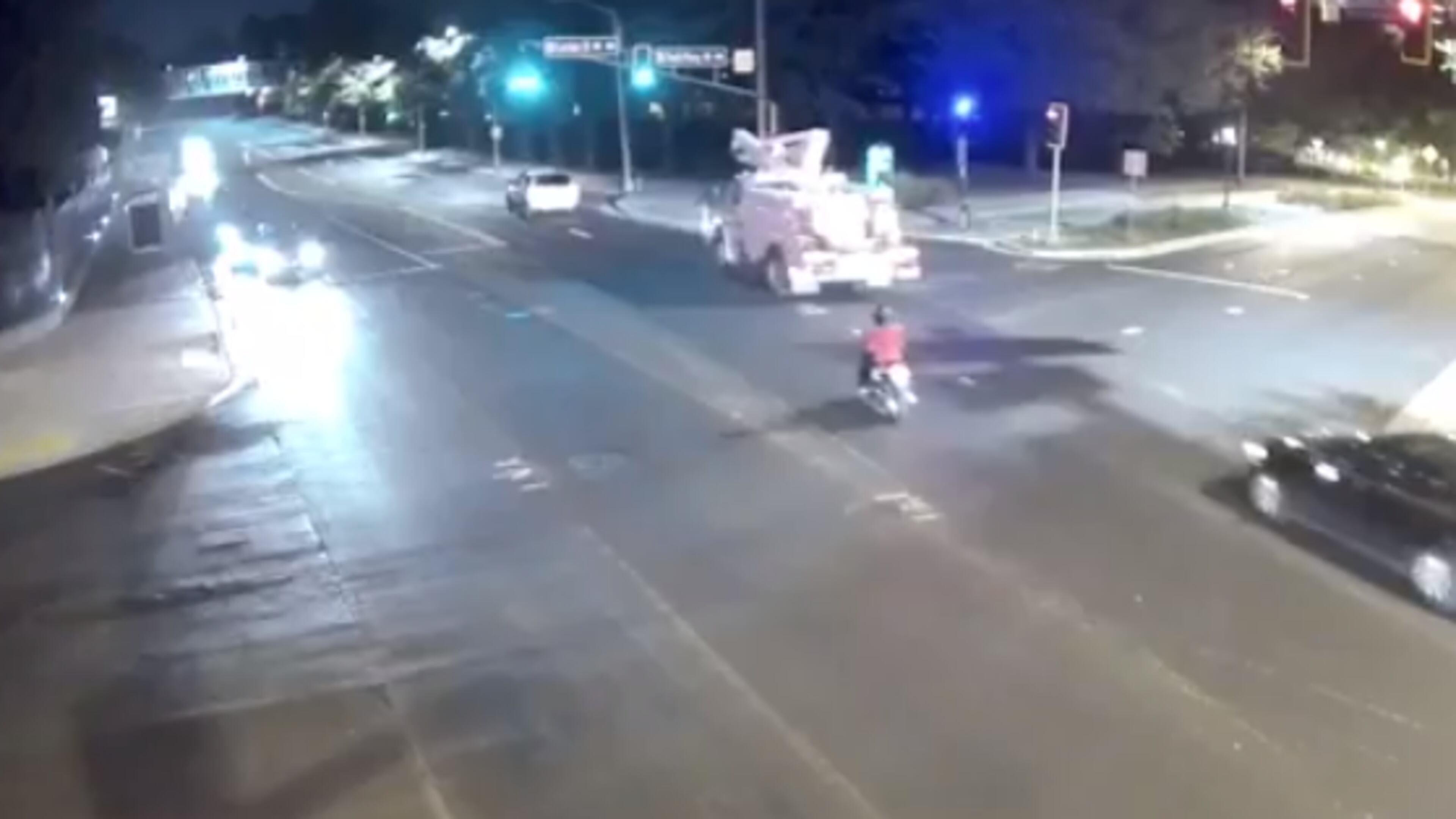 Surveillance video appears to show a woman on a moped being hit by a vehicle in northwest Atlanta.