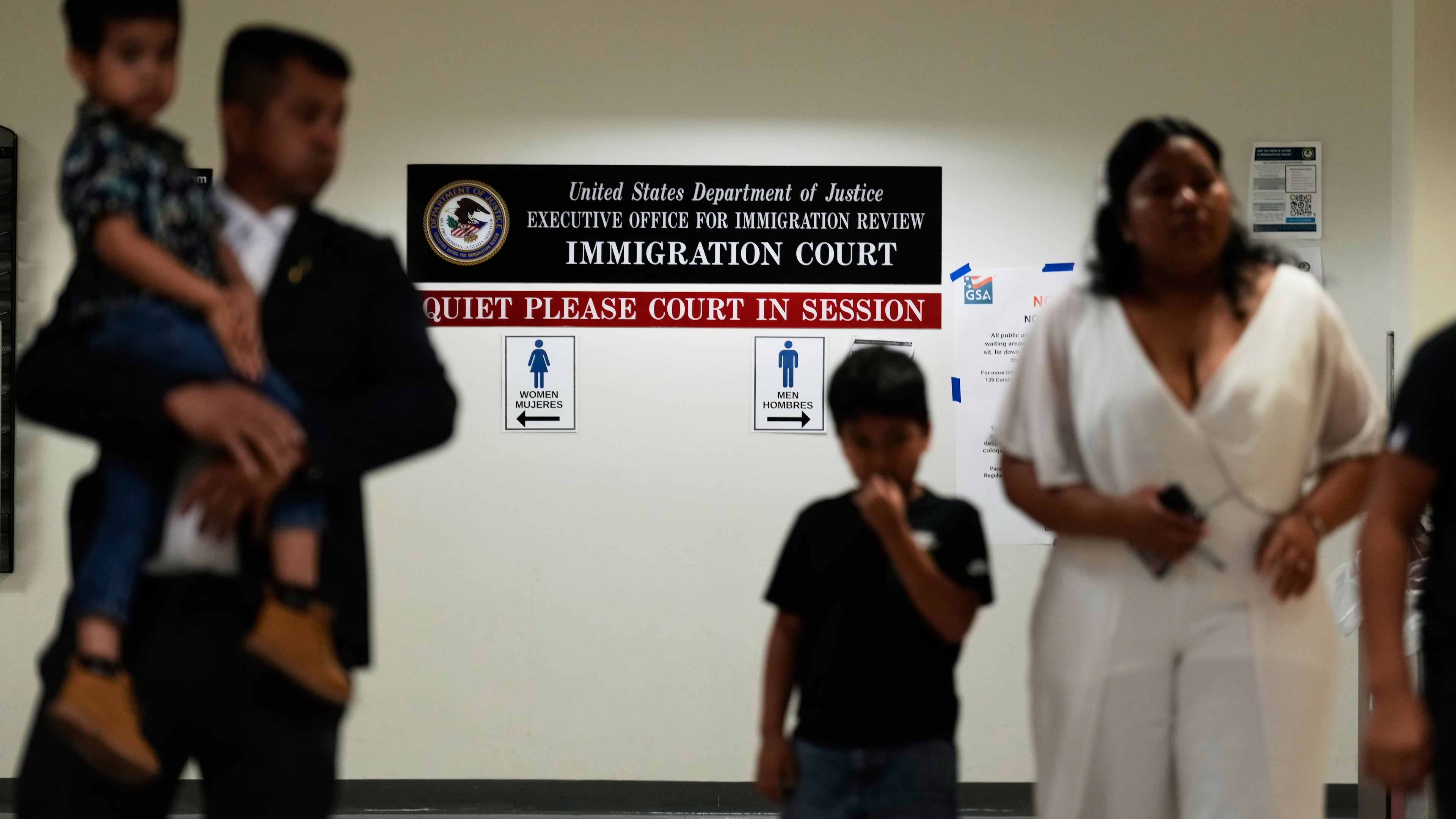 People arrive for immigration court hearings in New York, Monday, July 27, 2026. (AP Photo/Seth Wenig)
