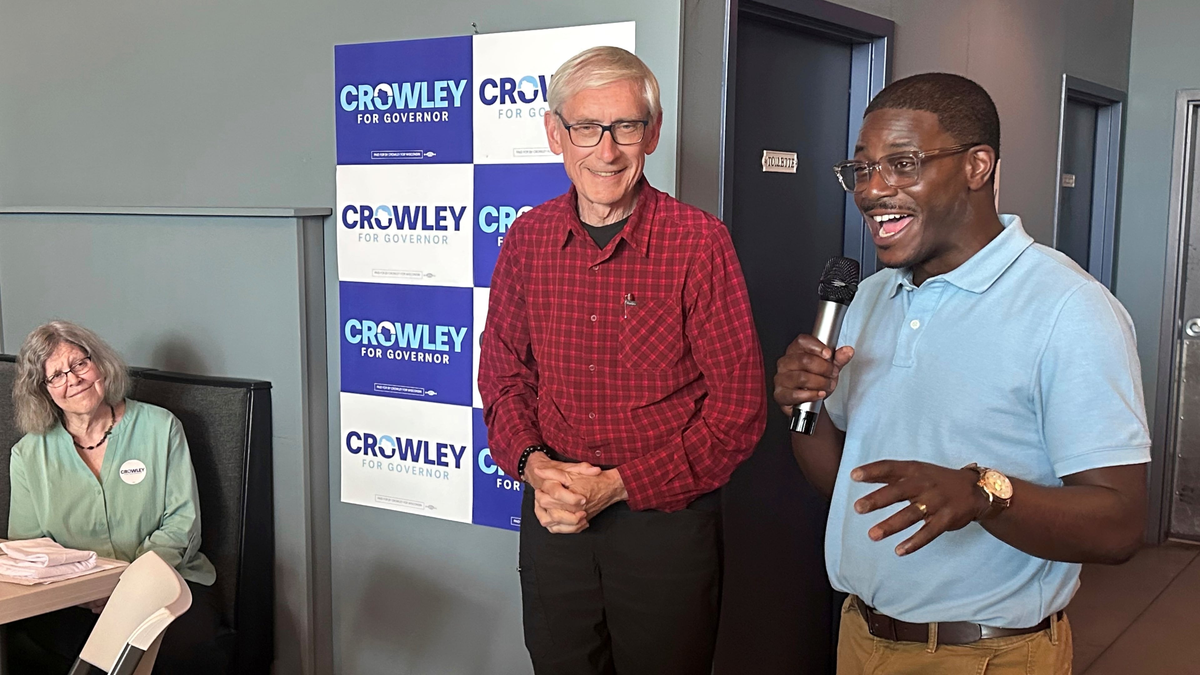 Wisconsin Gov. Tony Evers, center, campaigns with Democratic candidate for Governor David Crowley, right, Monday, Aug. 10, 2026, in Madison, Wis. (AP Photo/Scott Bauer)