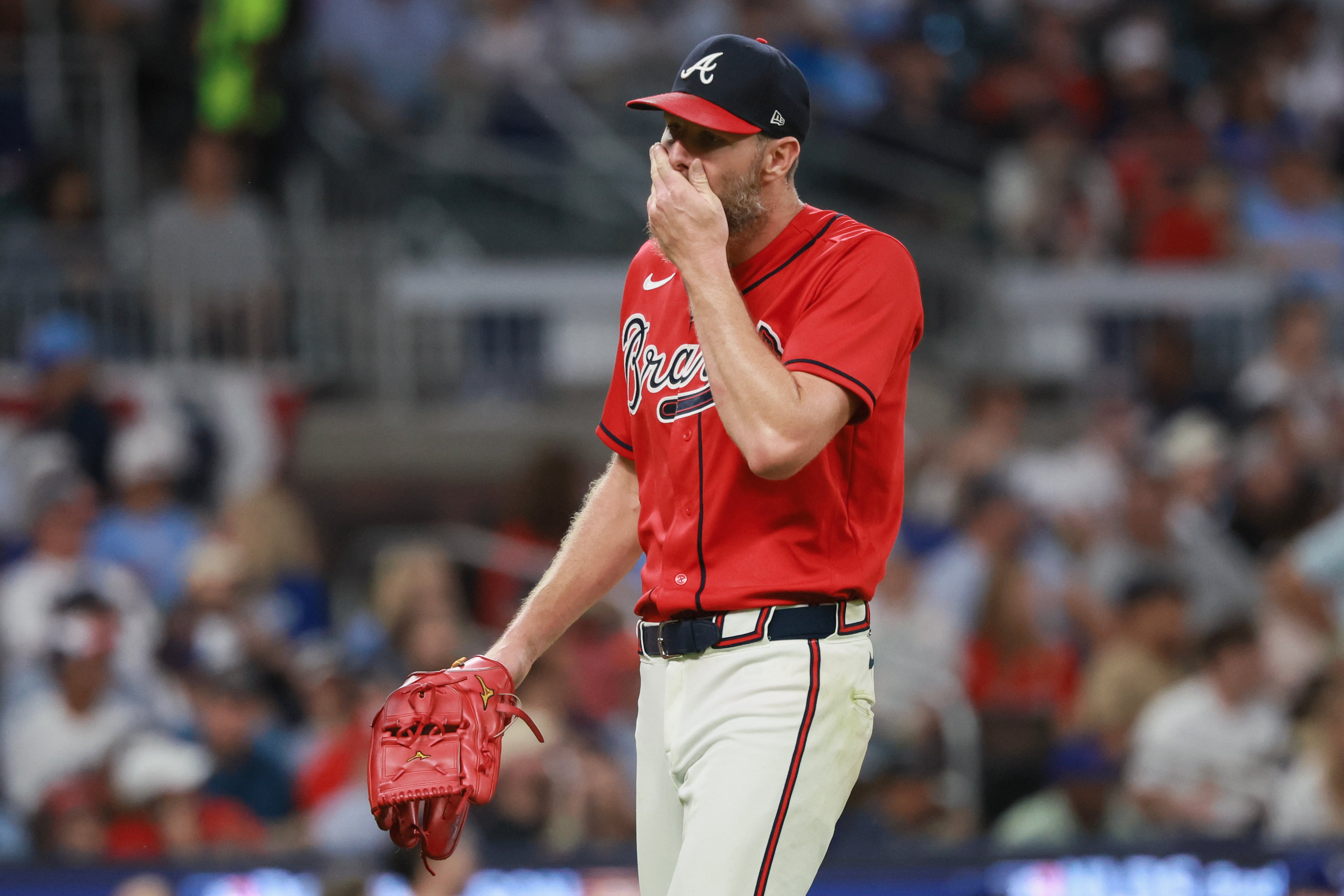 Atlanta Braves pitcher Chris Sale (51) walks to the dugout after giving up two home runs to the Los Angeles Dodgers during the fourth inning of Game 3 of the MLB National League Division Series between the Atlanta Braves and the Los Angeles Dodgers, Tuesday, Oct. 6, 2026, in Atlanta. (Jason Getz/AJC)