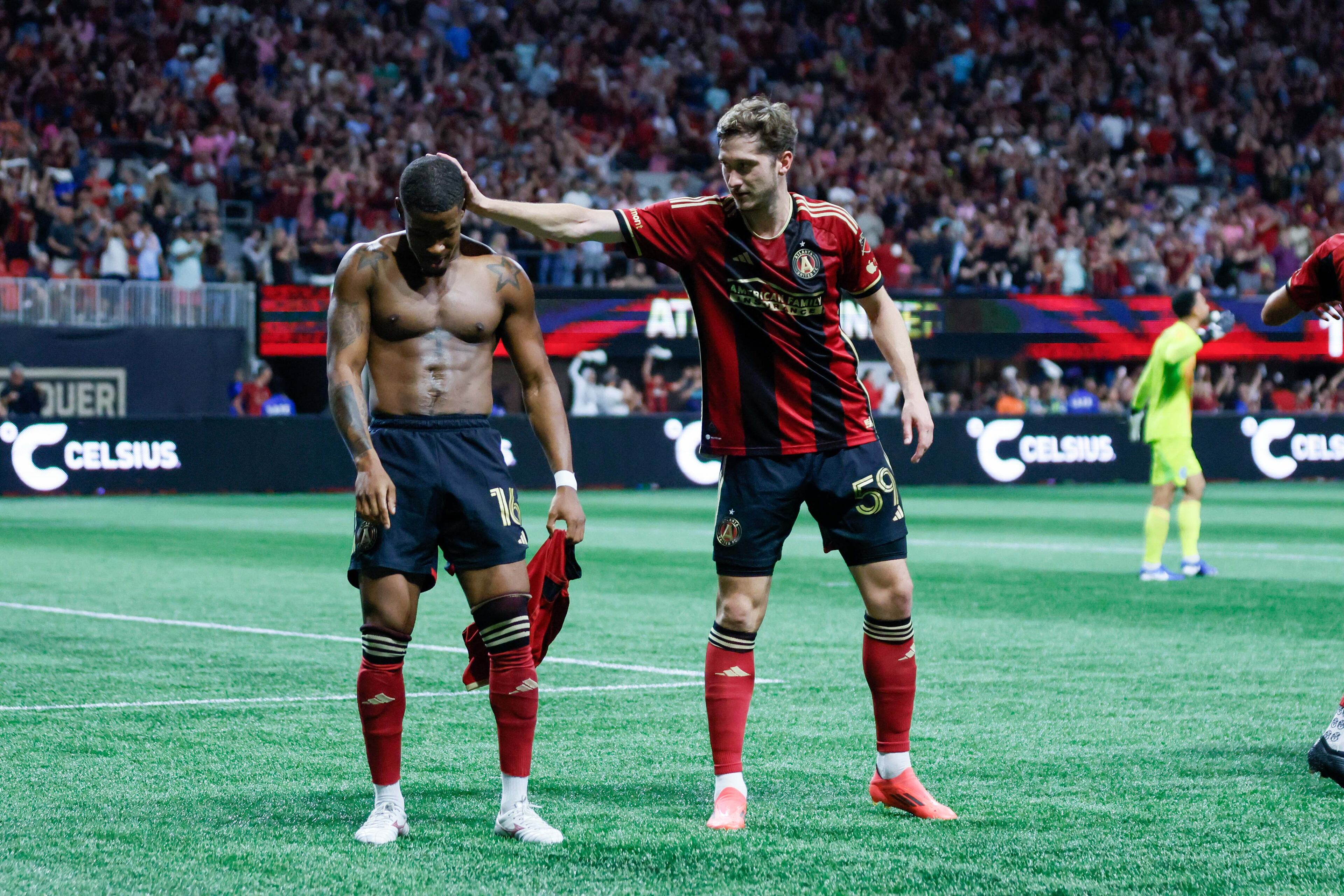 Atlanta United midfielder Aleksey Miranchuk (59) celebrates with Xande Silva (16).
(Miguel Martinez/ AJC)