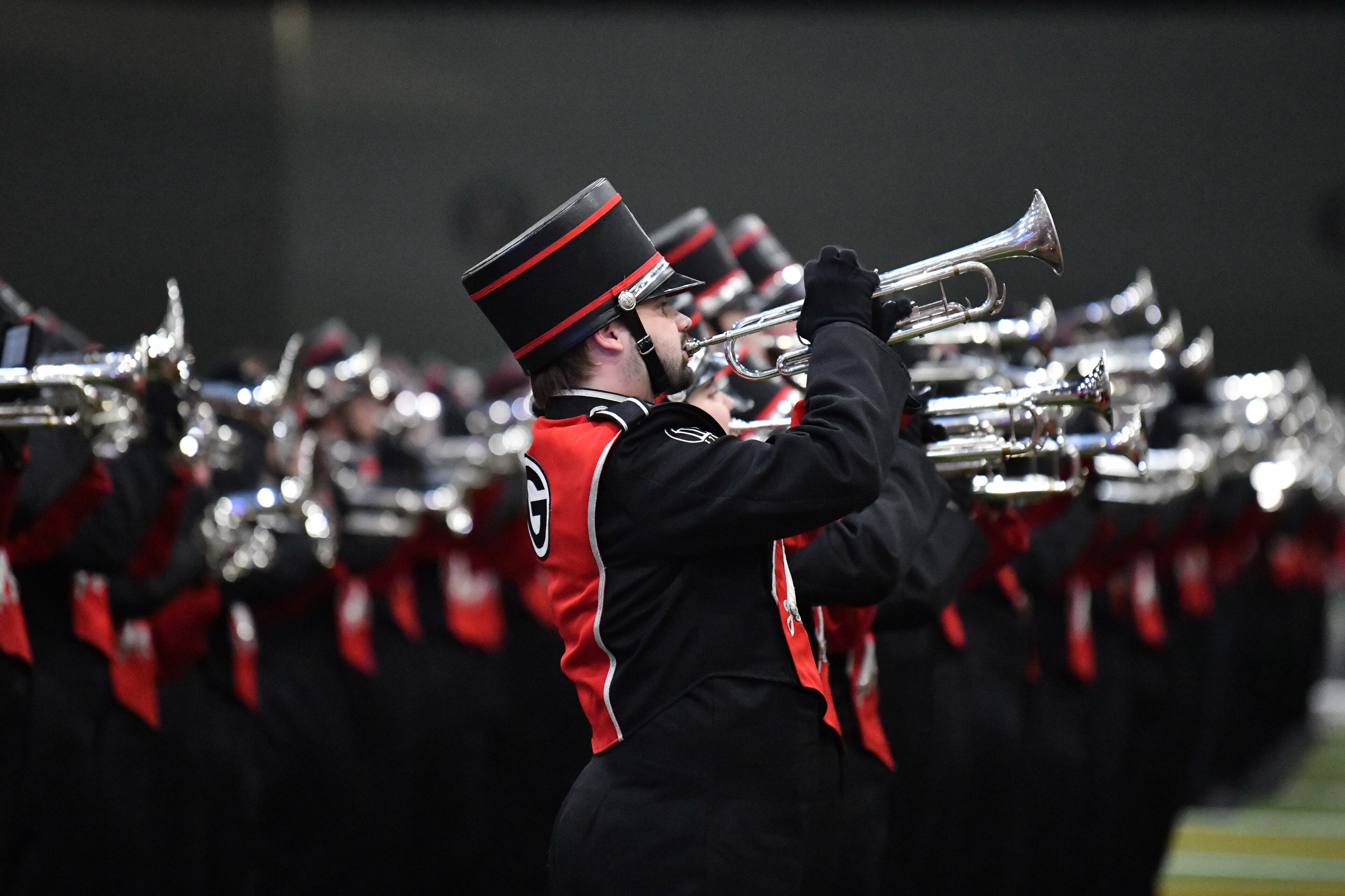 Georgia Redcoat Marching Band, cheerleaders, baton twirlers and Hairy Dog perform during a pep rally at the Playoff Fan Central at the LA Convention Center, Sunday, Jan. 8, 2023, in Los Angeles. (Hyosub Shin / Hyosub.Shin@ajc.com)