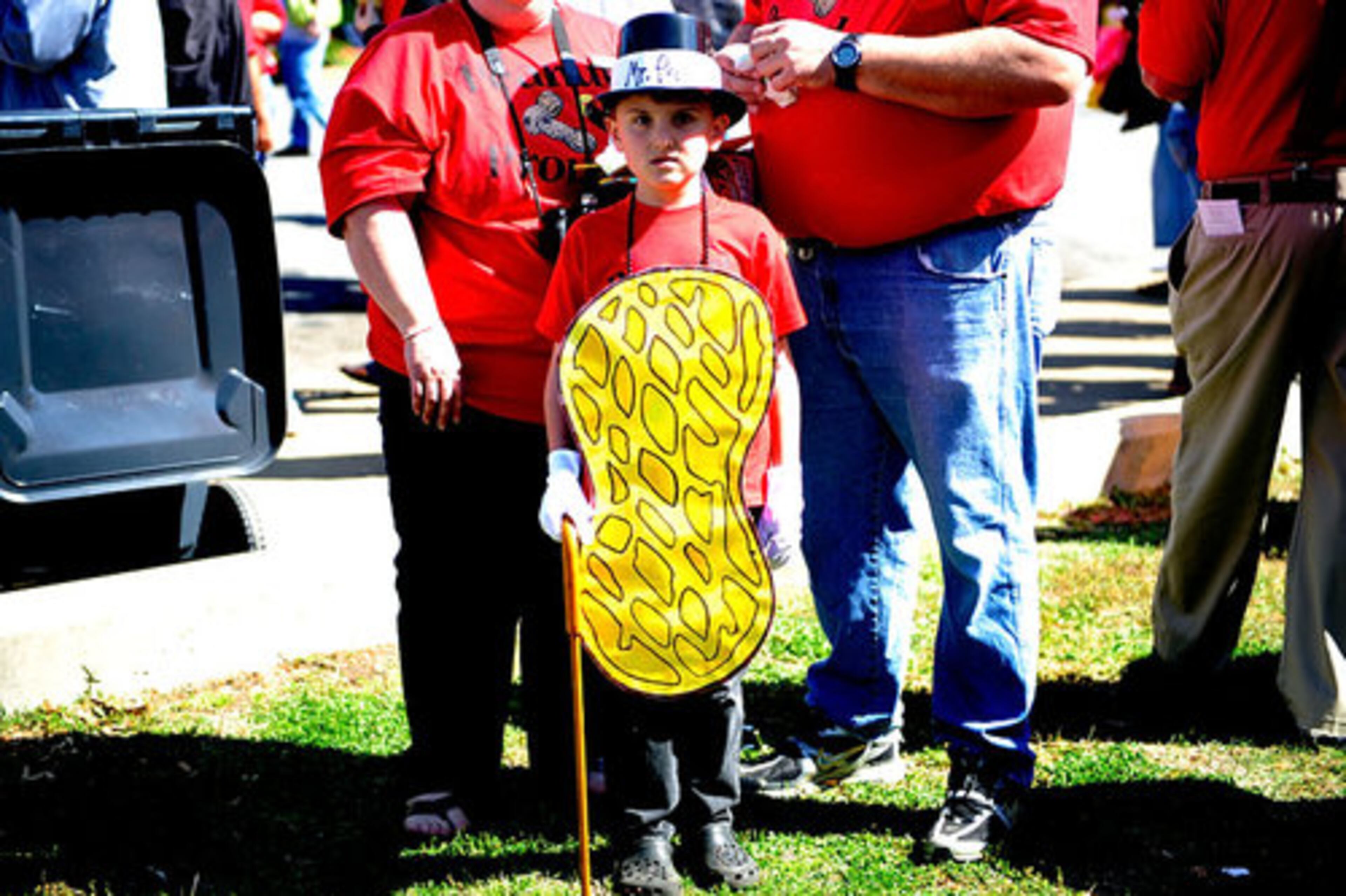 Collin Wilson, 6, stands in costume with his parents (from left) Angie and Bruce Wilson.