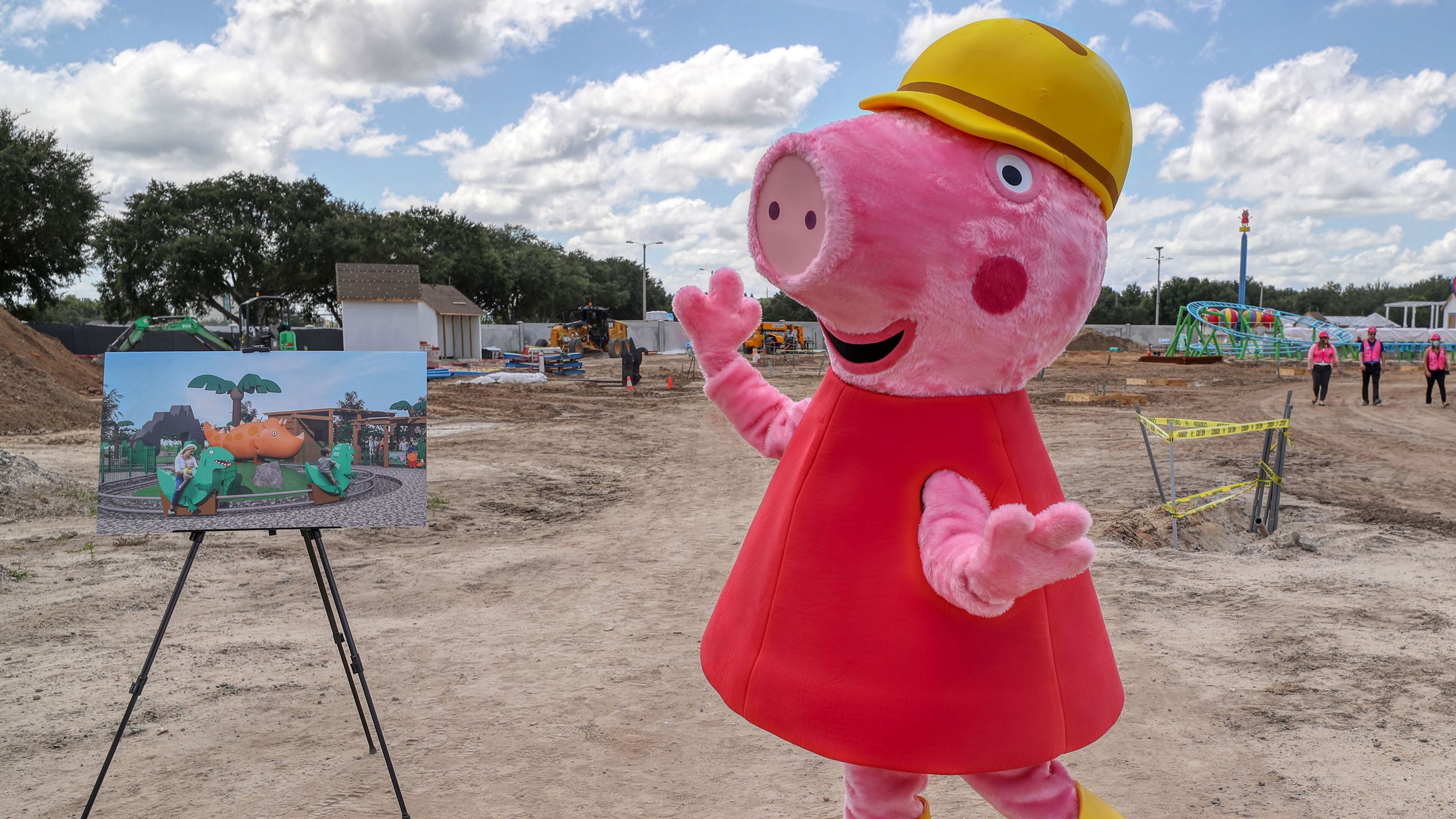 In a high-dynamic-range composite image, Peppa Pig makes an appearance during a media tour of the Peppa Pig Theme Park construction progress, on August 19, 2021. The park, located "just steps from Legoland Florida Resort," is scheduled to open in 2022. (Ricardo Ramirez Buxeda/Orlando Sentinel/TNS)