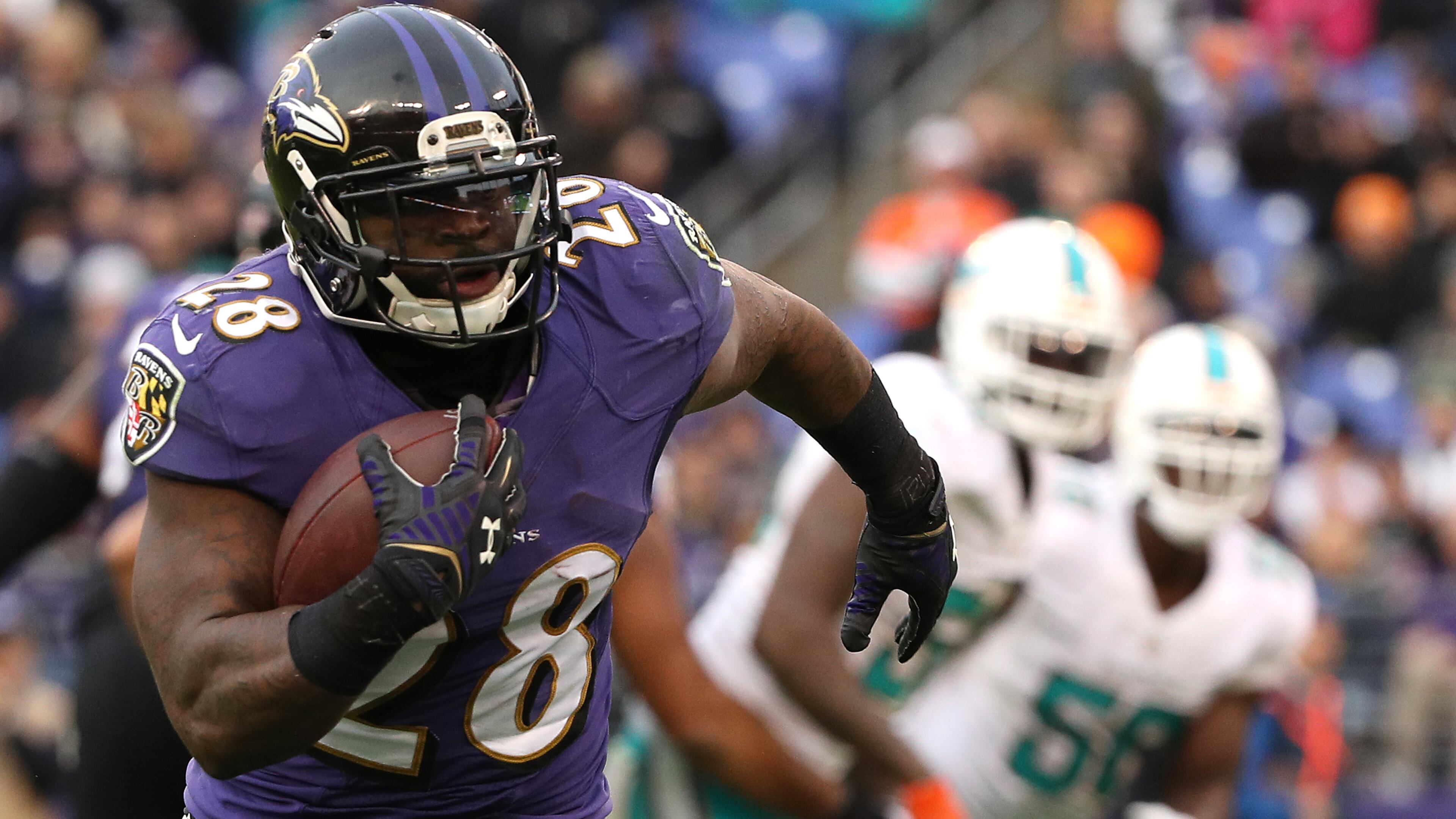BALTIMORE, MD - DECEMBER 4: Running back Terrance West #28 of the Baltimore Ravens scores a fourth quarter touchdown against the Miami Dolphins at M&T Bank Stadium on December 4, 2016 in Baltimore, Maryland. (Photo by Patrick Smith/Getty Images)