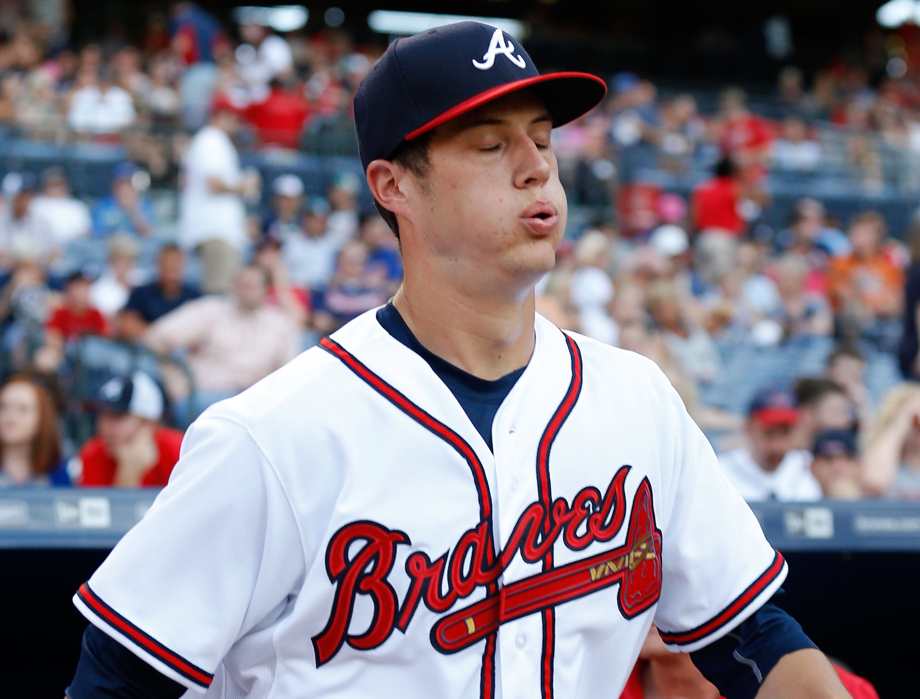 Pitcher Matt Wisler #37 of the Atlanta Braves takes a deep breath while walking out to the mound in the first inning of his Major League Baseball debut during the game against the New York Mets at Turner Field on June 19, 2015 in Atlanta, Georgia. (Photo by Mike Zarrilli/Getty Images)