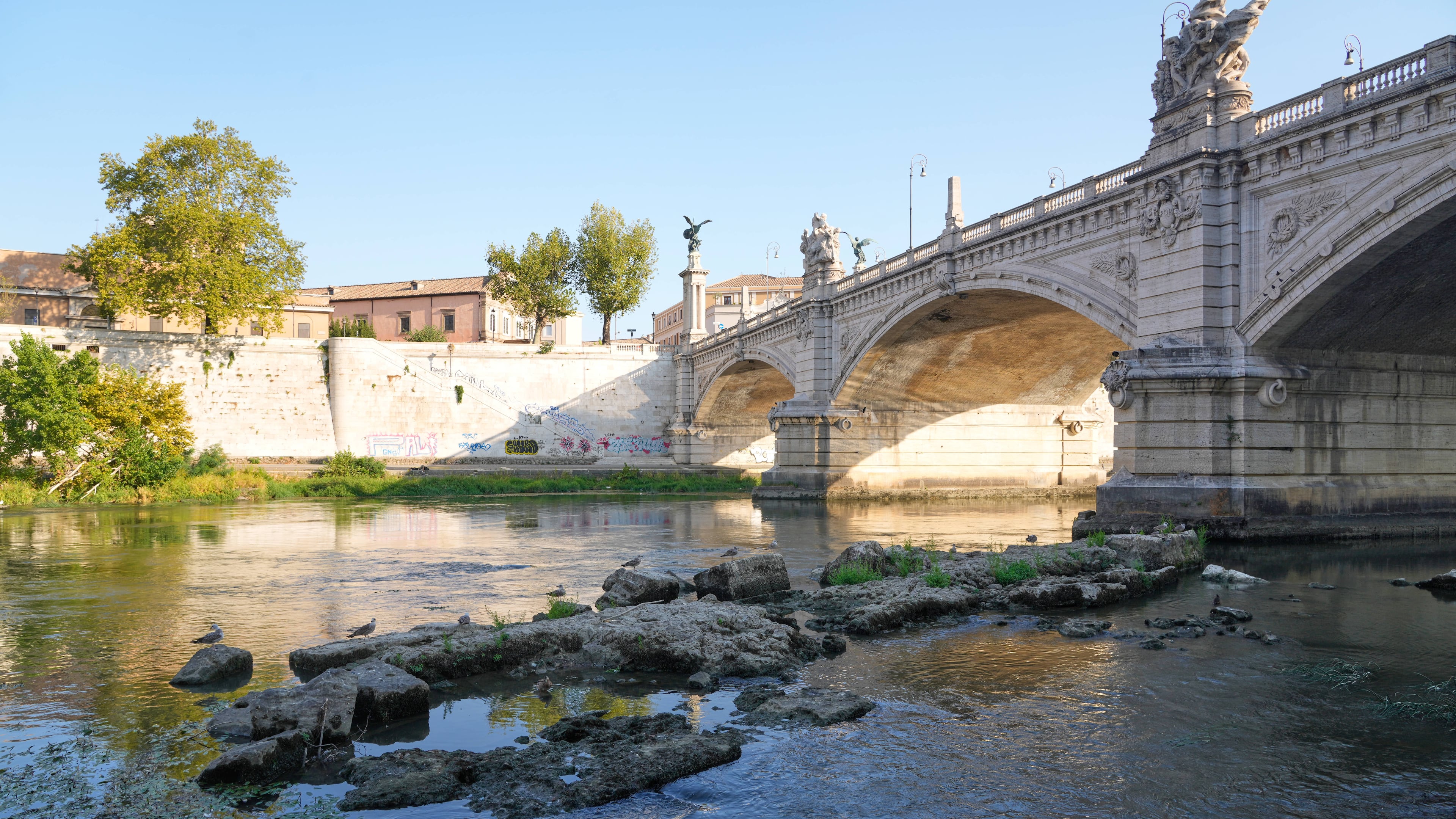 The ruins of the ancient Roman Neronian bridge, emerge from the riverbed of the Tiber river due to drought, in Rome, Thursday, Aug. 13, 2026. (AP Photo/Gregorio Borgia)