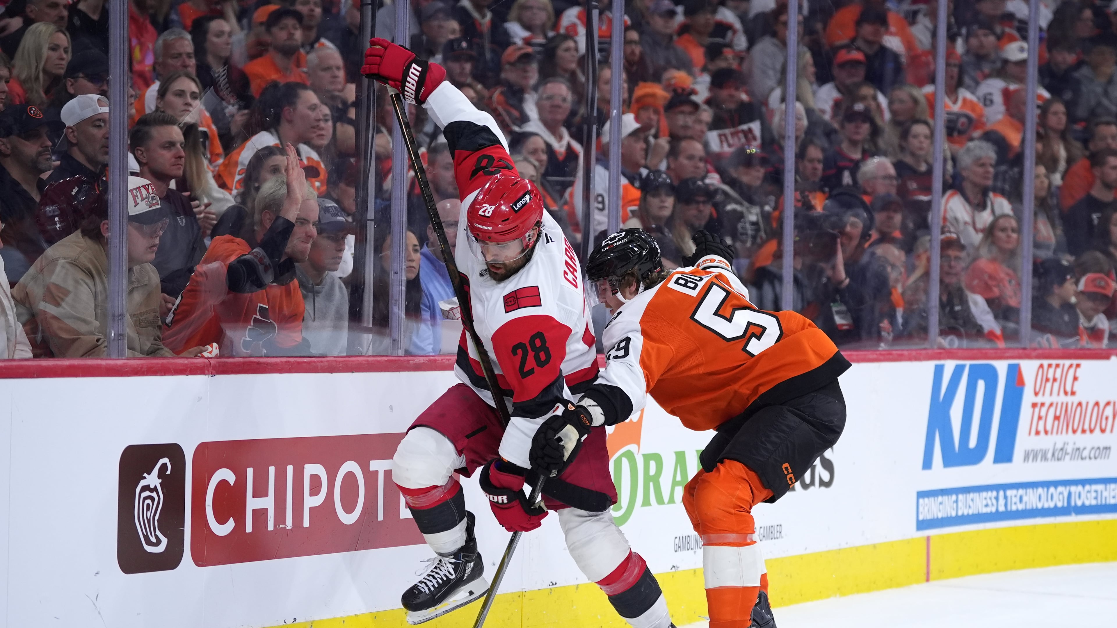 Carolina Hurricanes' William Carrier, left, tries to get past Philadelphia Flyers' Oliver Bonk, right, during the third period of Game 4 in a second-round NHL hockey Stanley Cup playoff series Saturday, May 9, 2026, in Philadelphia. (AP Photo/Matt Slocum)