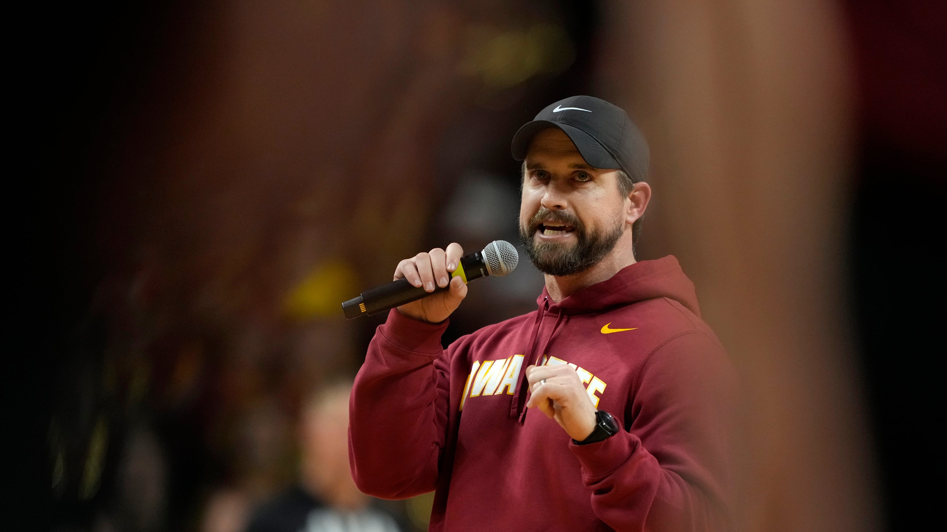 FILE - New Iowa State head football coach Jimmy Rogers speaks during a timeout in the first half of an NCAA college basketball game between Iowa State and Iowa, Dec. 11, 2025, in Ames, Iowa. (AP Photo/Charlie Neibergall, File)