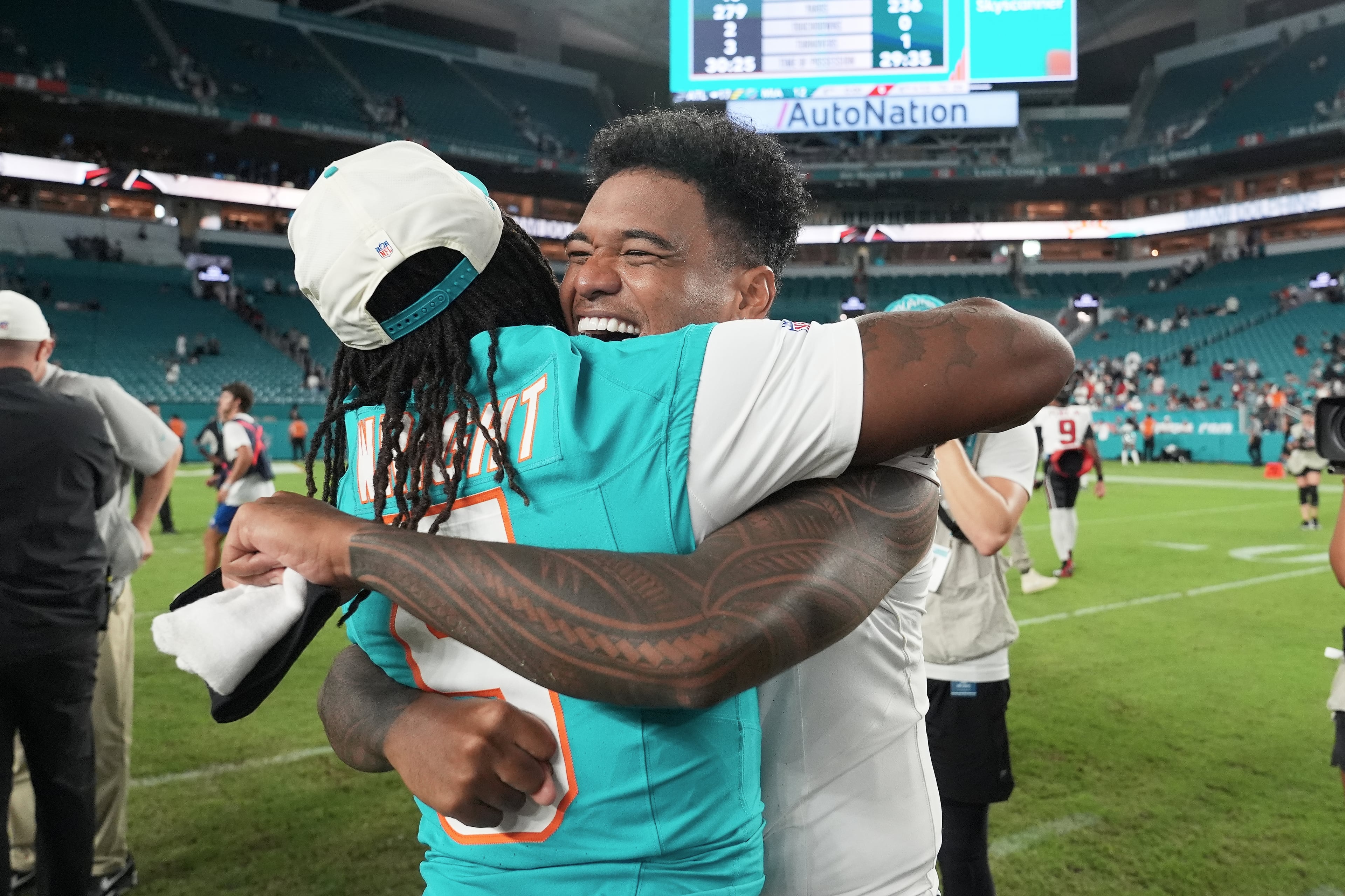 Dolphins running back Jaylen Wright (left) hugs Falcons quarterback Tua Tagovailoa on Friday, Aug. 28, 2026, in Miami Gardens, Fla. Tagovailoa’s return to Hard Rock Stadium featured plenty of feel-good moments. (Lynne Sladky/AP)