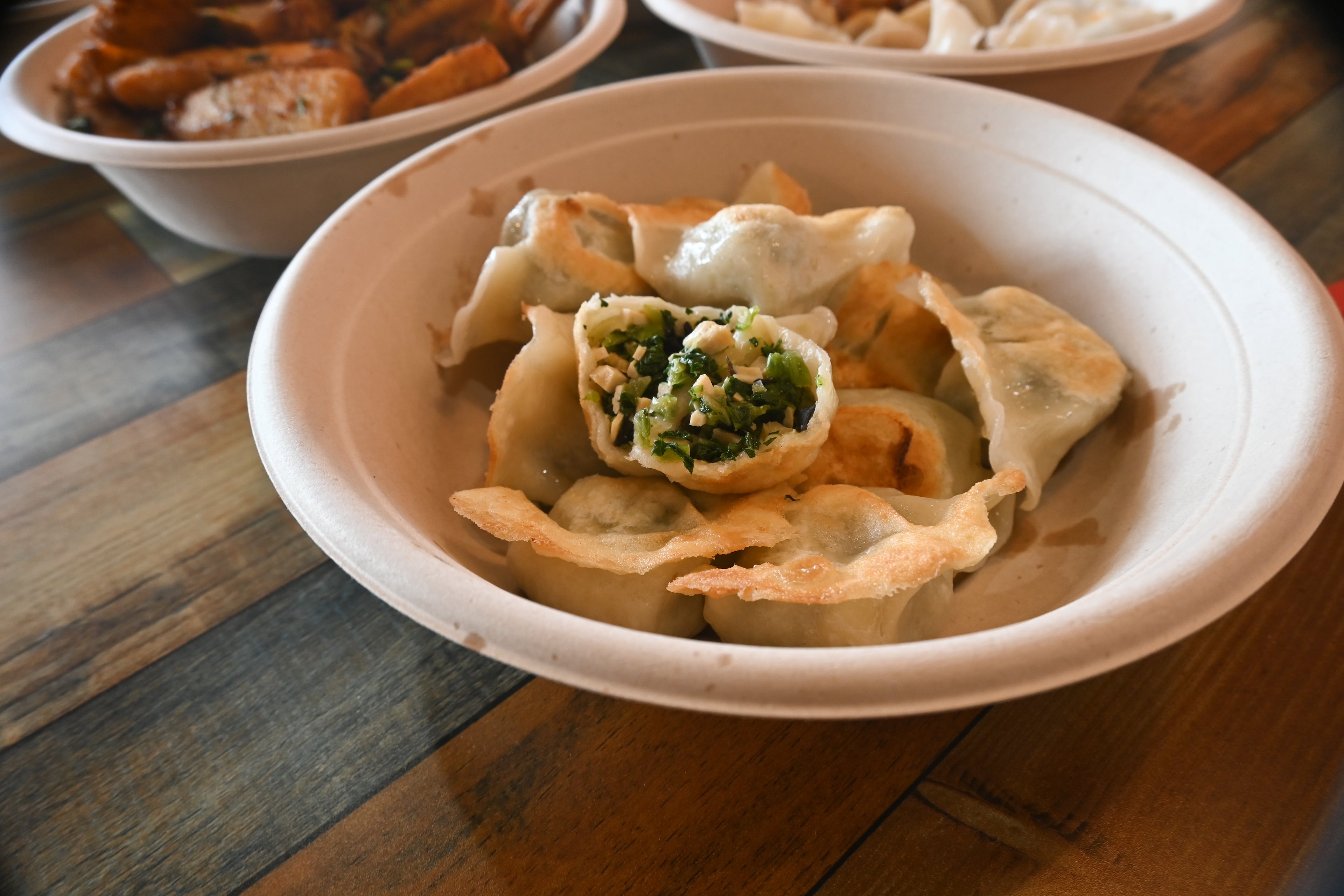 Pan-fried veggie dumplings filled with tofu skin, chives and wood ear mushroom. (Candy Hom for the AJC)