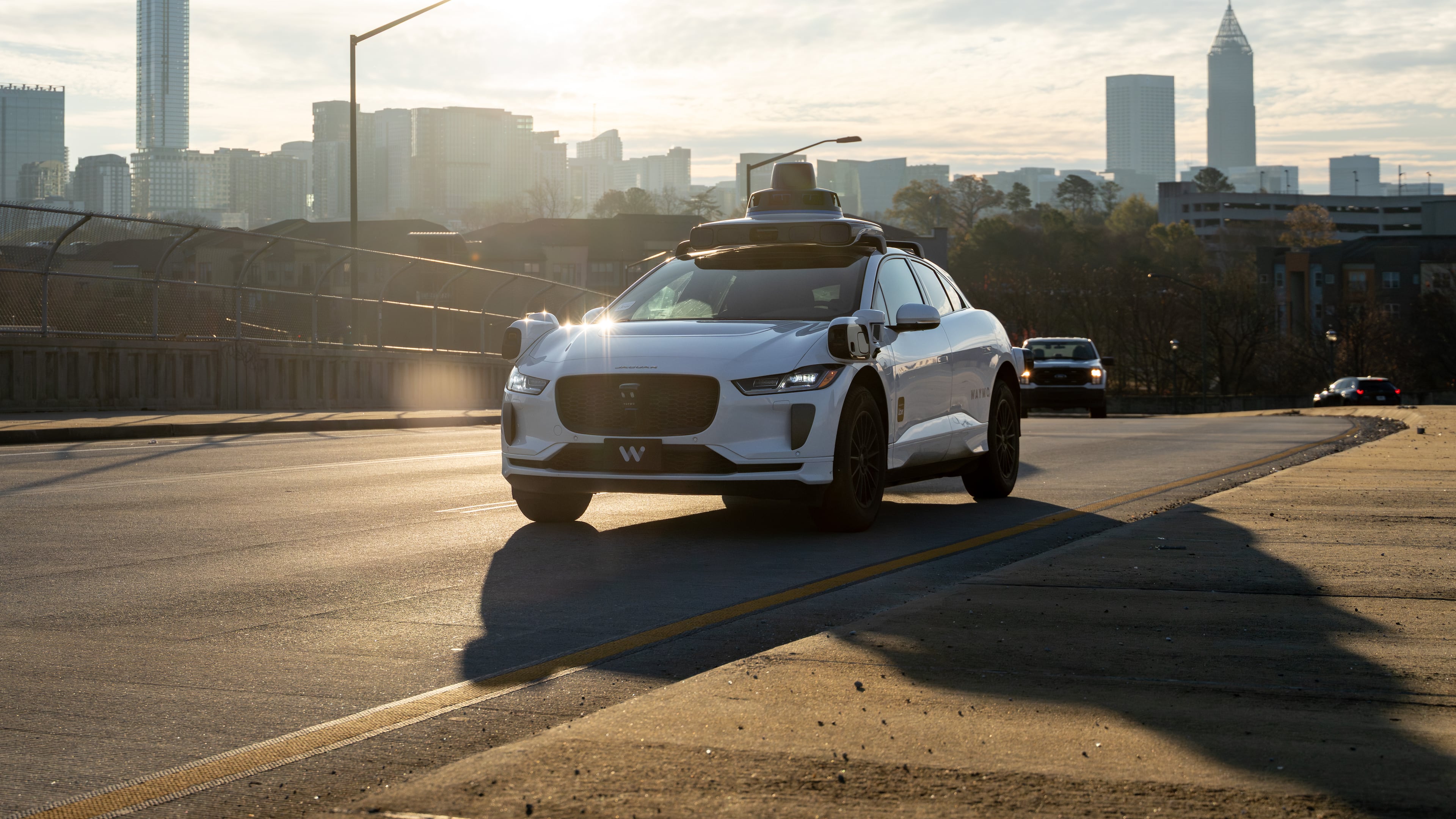A Waymo self-driving taxi travels down 17th Street in Atlanta, Thursday, Dec. 11, 2025 (Ben Hendren for the AJC)