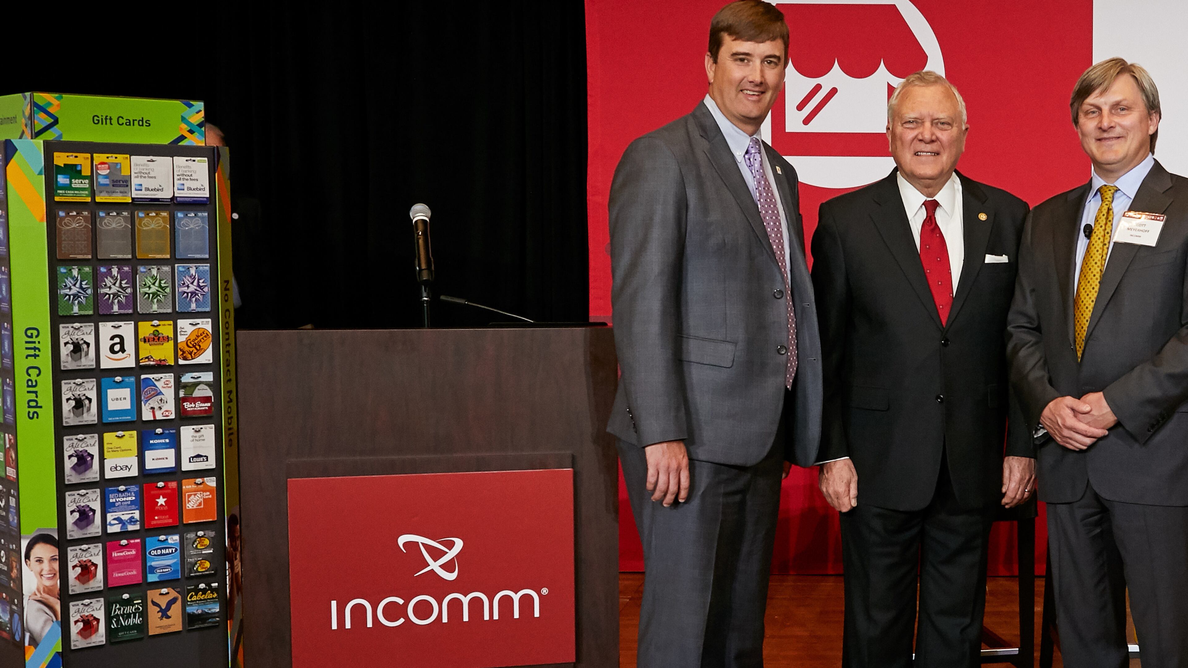 From left: Bert Brantley, chief operating officer at the state Department of Economic Development, Gov. Nathan Deal and Scott Meyerhoff, COO and chief financial officer of InComm.