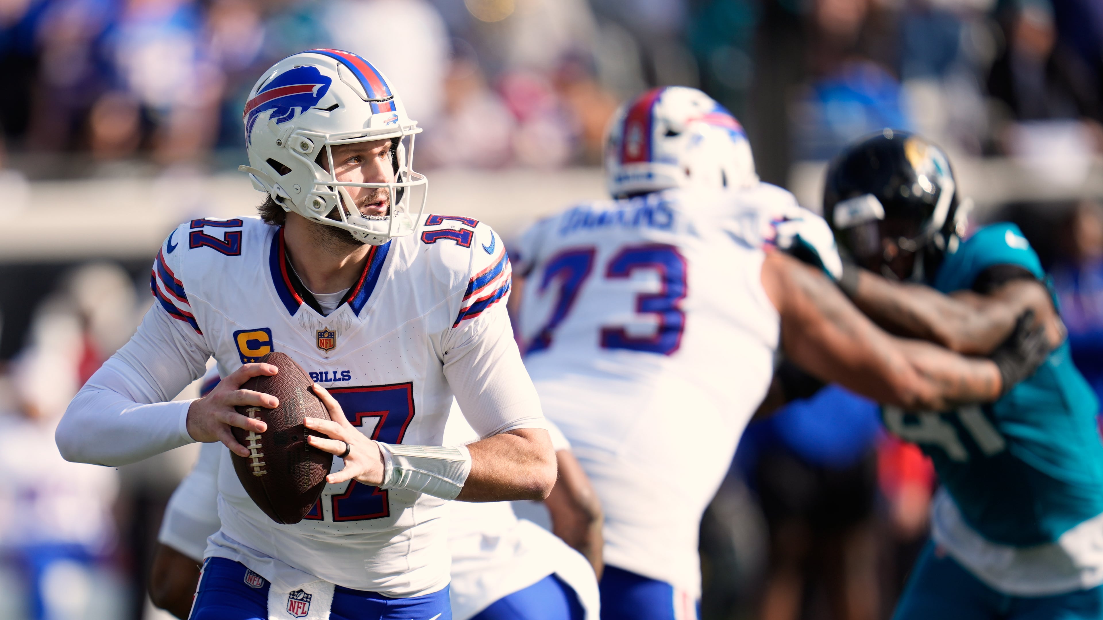 FILE - Buffalo Bills quarterback Josh Allen (17) looks for a receiver during the second half of an NFL wild card playoff football game against the Jacksonville Jaguars, Jan. 11, 2026, in Jacksonville, Fla. (AP Photo/John Raoux, File)