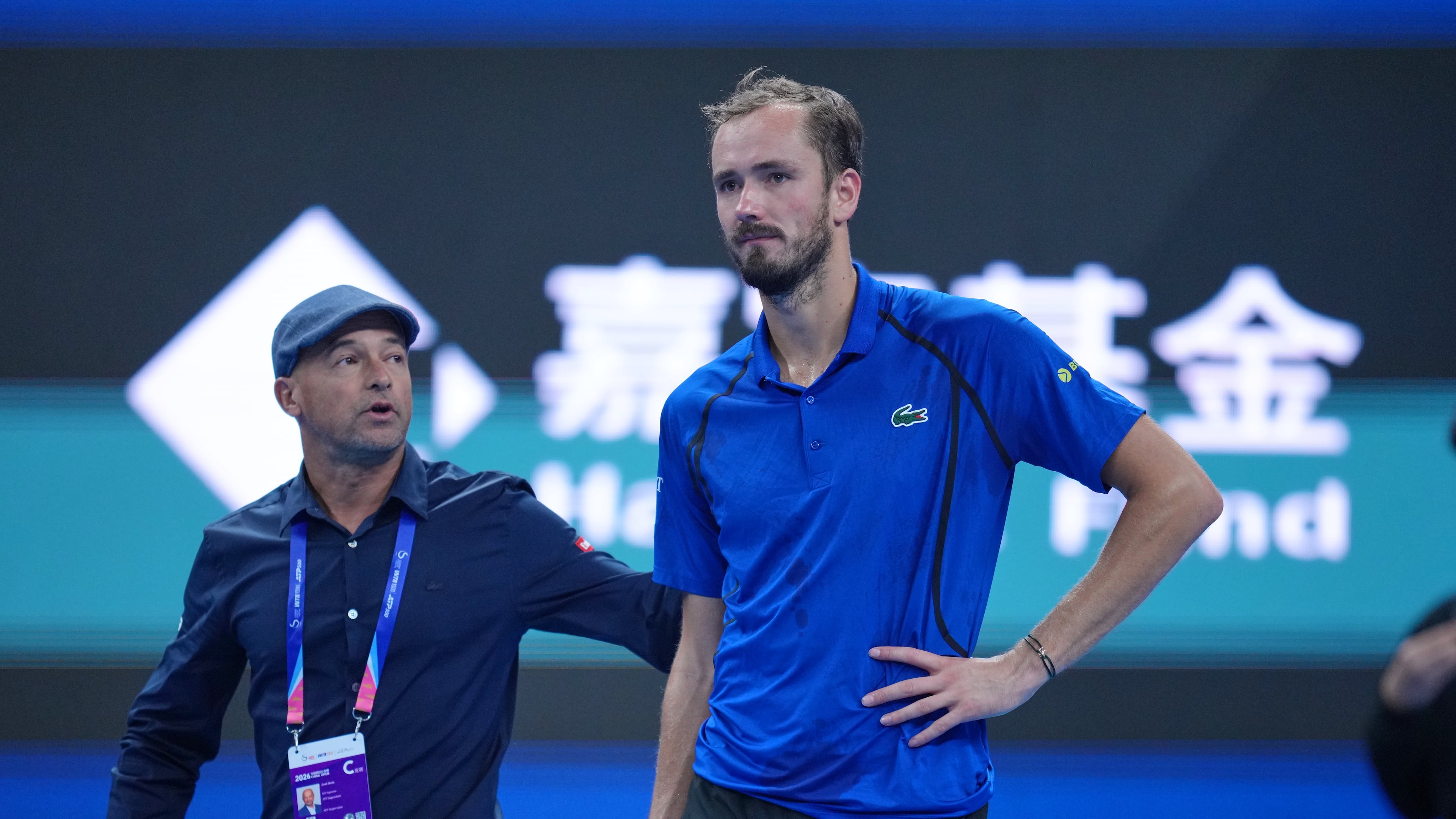 Daniil Medvedev, of Russia, looks on after being disqualified during a semi final match against Novak Djokovic, of Serbia at the China Open tennis tournament in Beijing, Monday, Oct. 5, 2026. (AP Photo/Achmad Ibrahim)