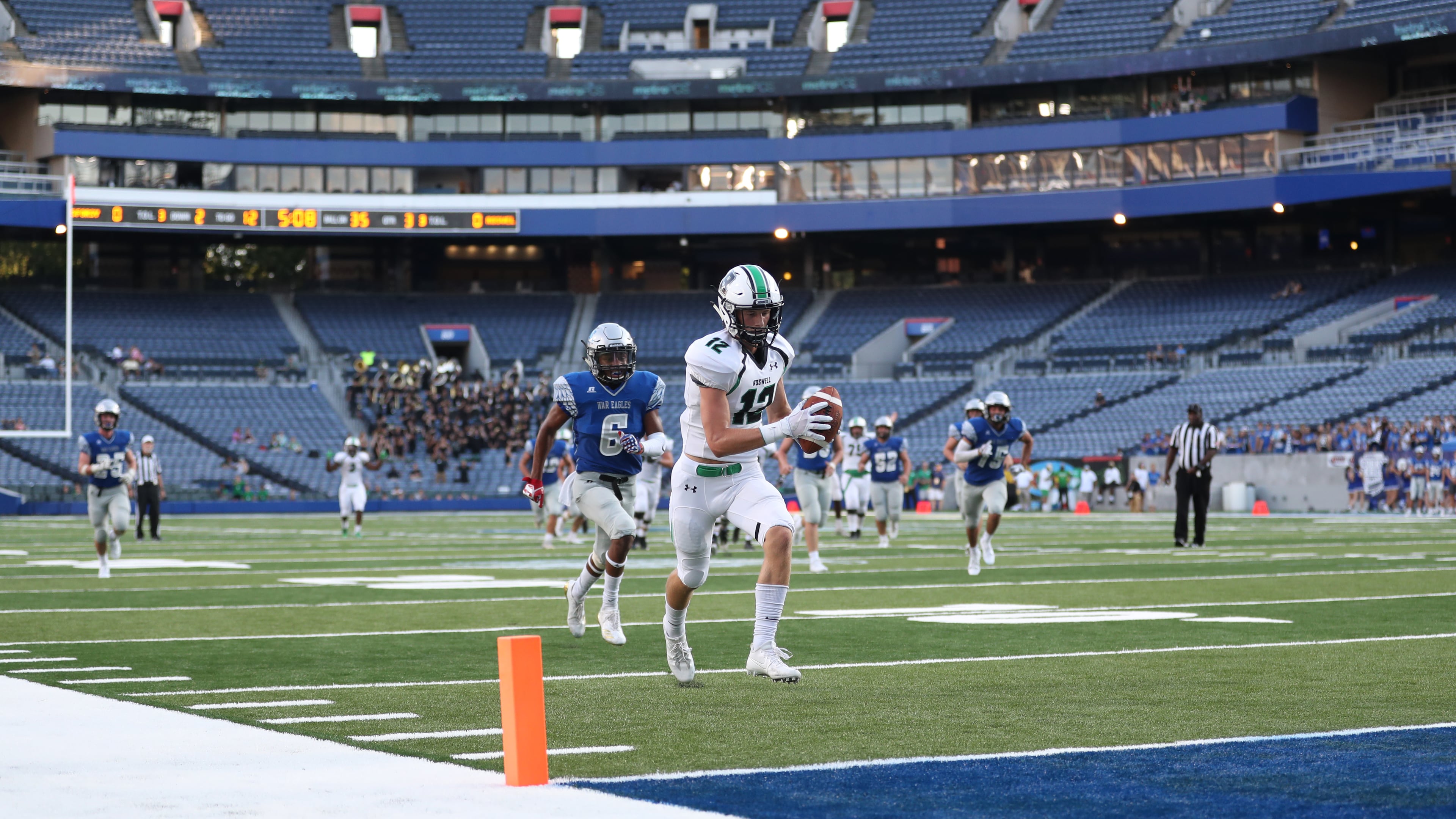 Roswell wide receiver Walt Warren scores on a 34-yard pass in the third quarter of their game against South Forsyth during the Corky Kell Classic at Georgia State Stadium Friday, August 18, 2017, in Atlanta.