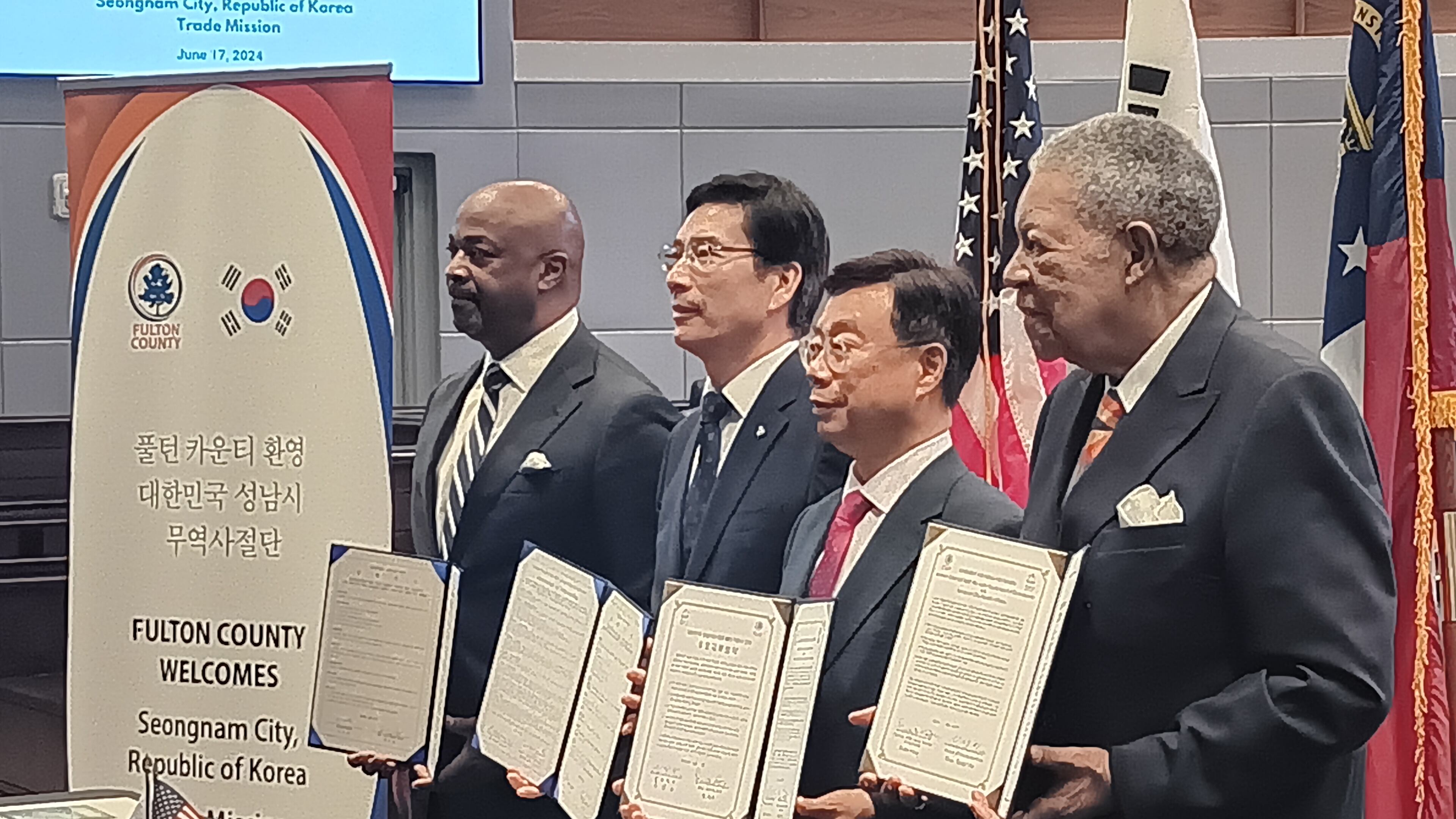 Officials from Seongnam, South Korea, and Fulton County hold copies of formal agreements on cooperation and cultural exchange Monday, June 17, 2024.
From left to right: Kwanza Hall, vice chair of Develop Fulton; Euijoon Lee, president and CEO of Seongnam Industry Promotion Agency; Seongnam Mayor Sang-Jin Shin; and Fulton Commission Chair Robb Pitts.
The Korean delegation is looking at cities including College Park, East Point and Fairburn as possible sites for high-tech investments.