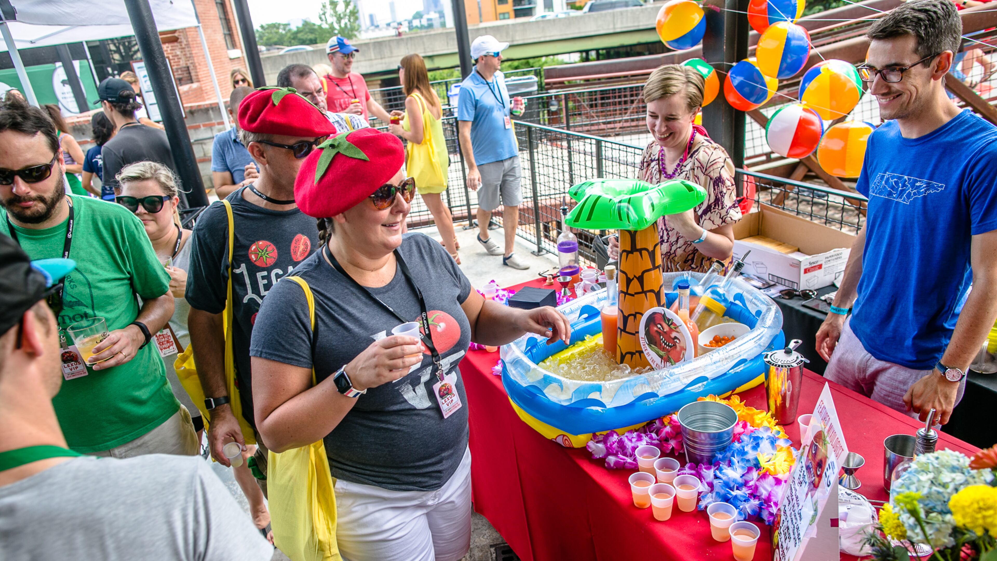 Tomatoes are everywhere, even on top of some heads, at the Attack of the Killer Tomato Festival, which happens on July 14.