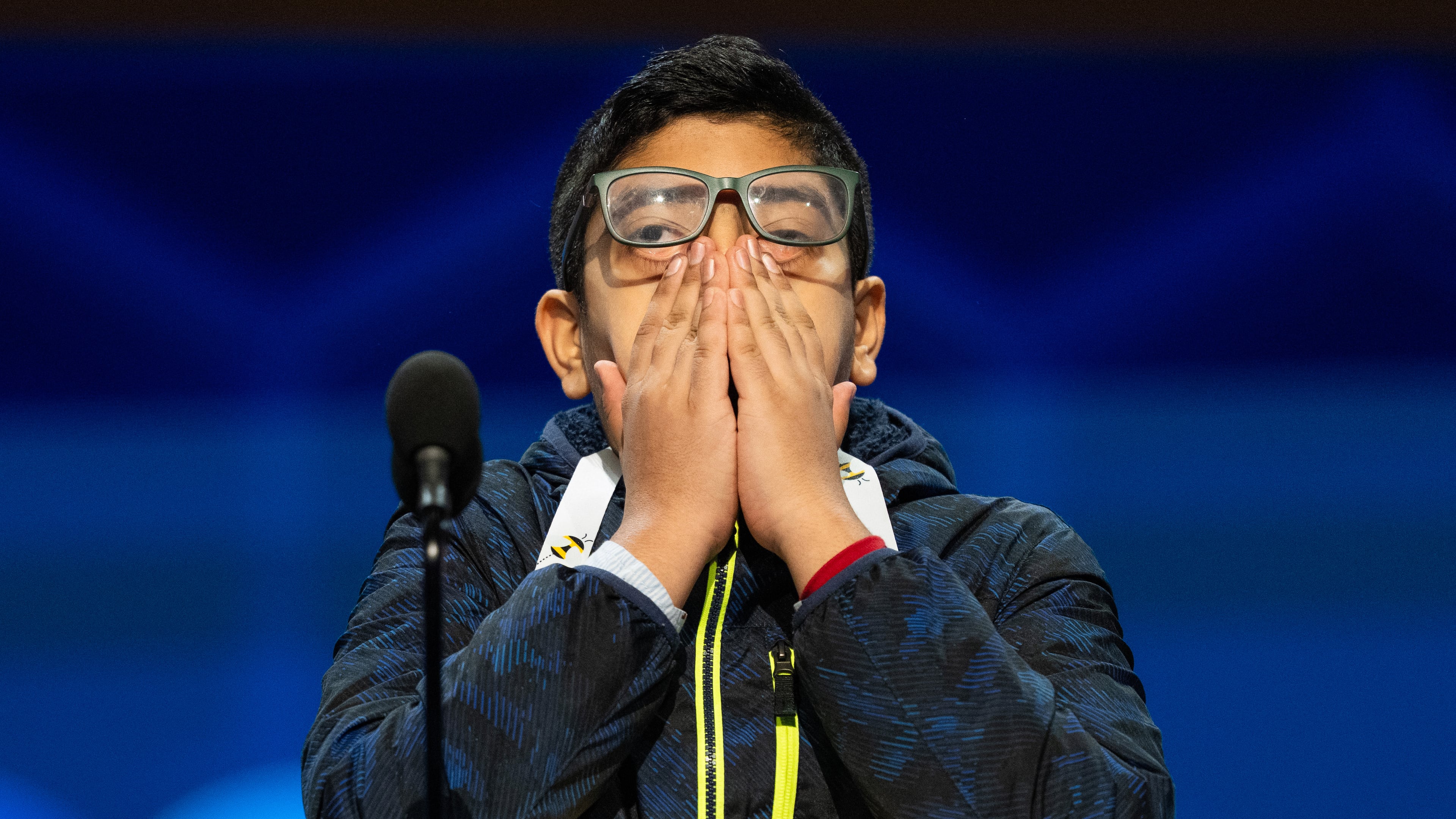 Anay Mahesh, 13, of Orlando, Fla., reacts after answering incorrectly during the quarterfinals of the Scripps National Spelling Bee, Wednesday, May 27, 2026, in Washington. (AP Photo/Allison Robbert)