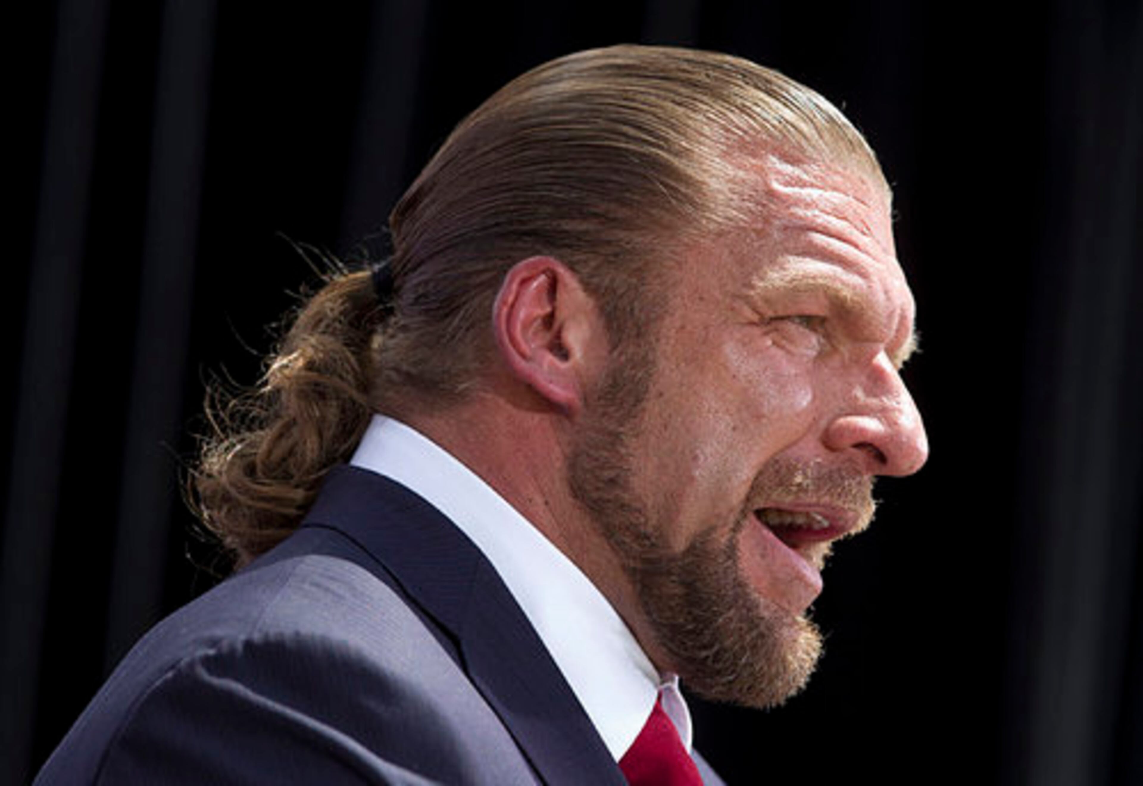 WWE superstar Triple H addresses the media during the WrestleMania 28 press conference Wednesday, March 28, 2012, in Miami Beach, Florida.