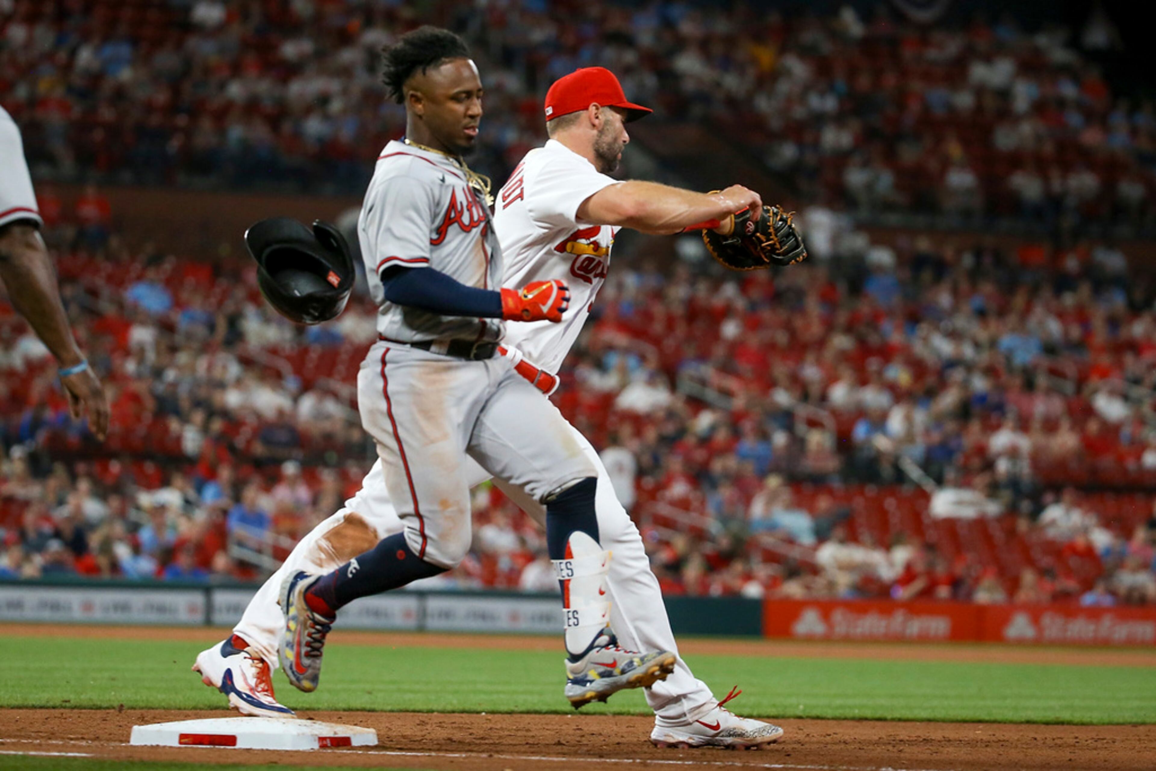 Atlanta Braves' Ozzie Albies is out at first after grounding into a double play during the fifth inning of the team's baseball game against the St. Louis Cardinals on Tuesday, April 4, 2023, in St. Louis. (AP Photo/Scott Kane)