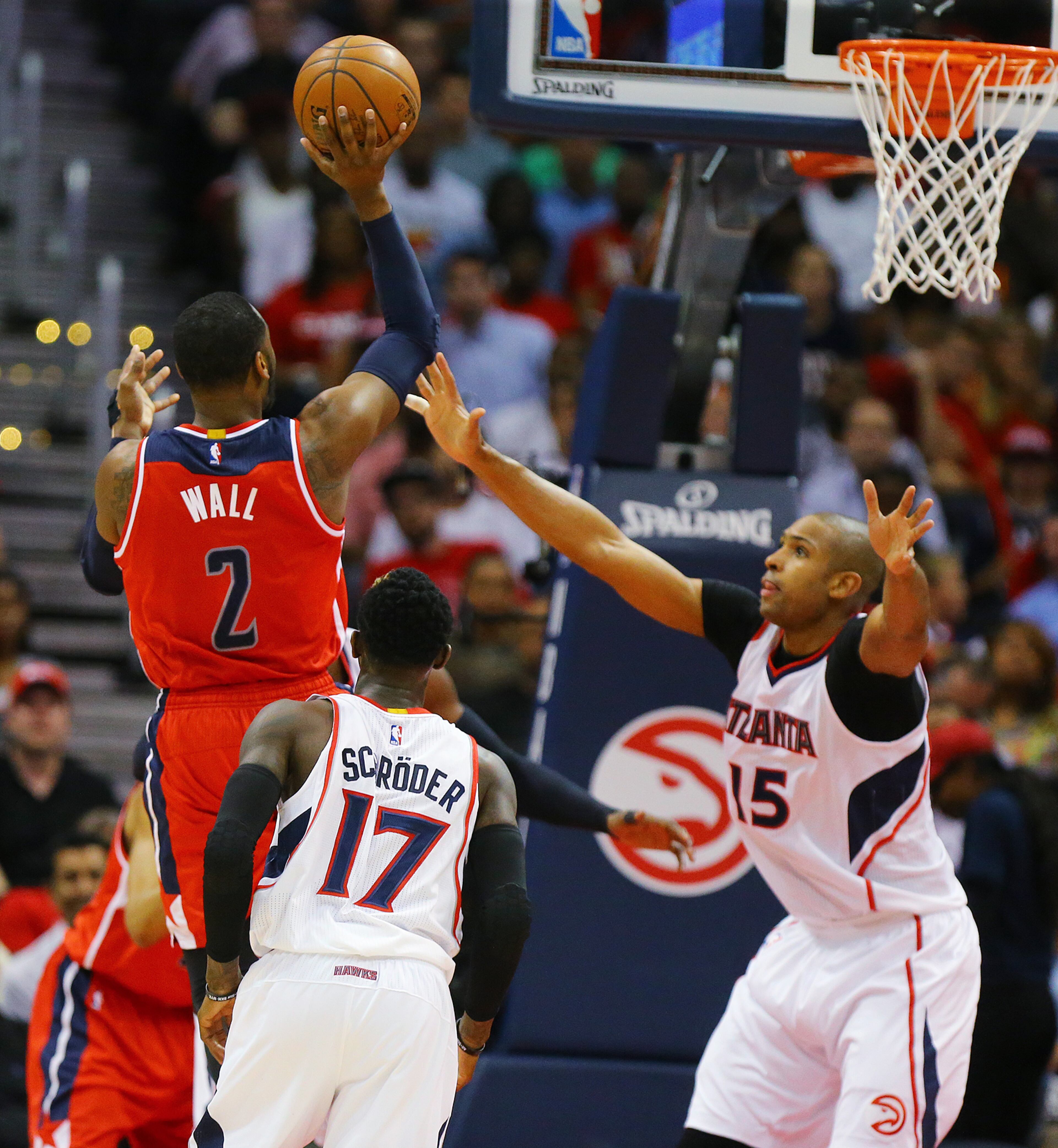 Wizards John Wall shoots for two points over Hawks Al Horford in their Eastern Conference Semifinals game 5 on Tuesday, May 13, 2015, in Atlanta. Curtis Compton / ccompton@ajc.com