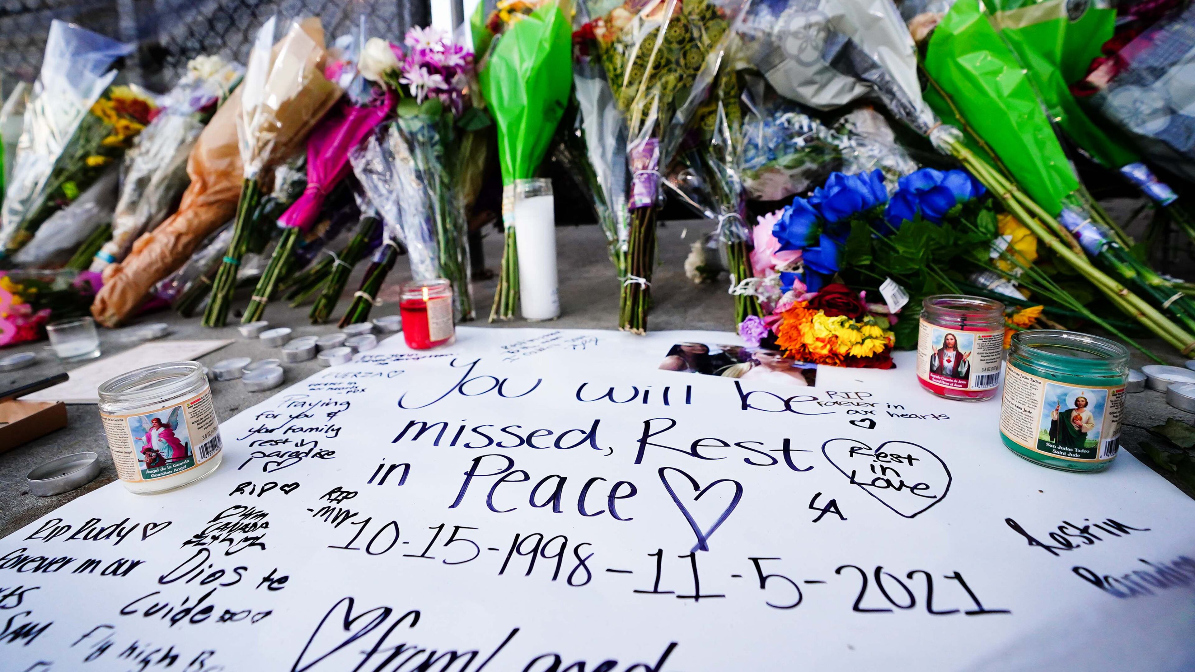 Candles, flowers and letters are placed at a memorial outside of the canceled Astroworld festival at NRG Park on Nov. 7, 2021, in Houston. According to authorities, eight people died and 17 people were transported to local hospitals after what was described as a crowd surge at the Astroworld festival, a music festival started by Houston-native rapper and musician Travis Scott in 2018. (Alex Bierens de Haan/Getty Images/TNS)