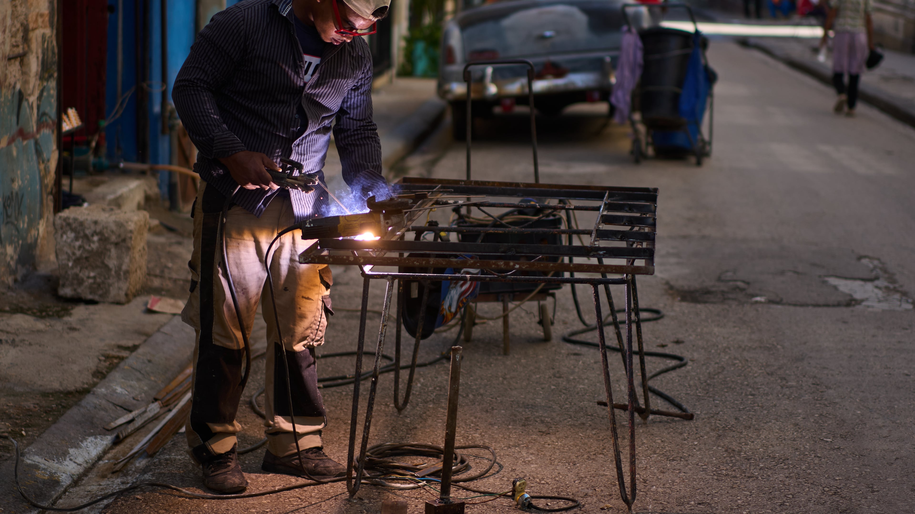 A blacksmith welds a door in Havana, Cuba, Tuesday, June 9, 2026. (AP Photo/Ramon Espinosa)