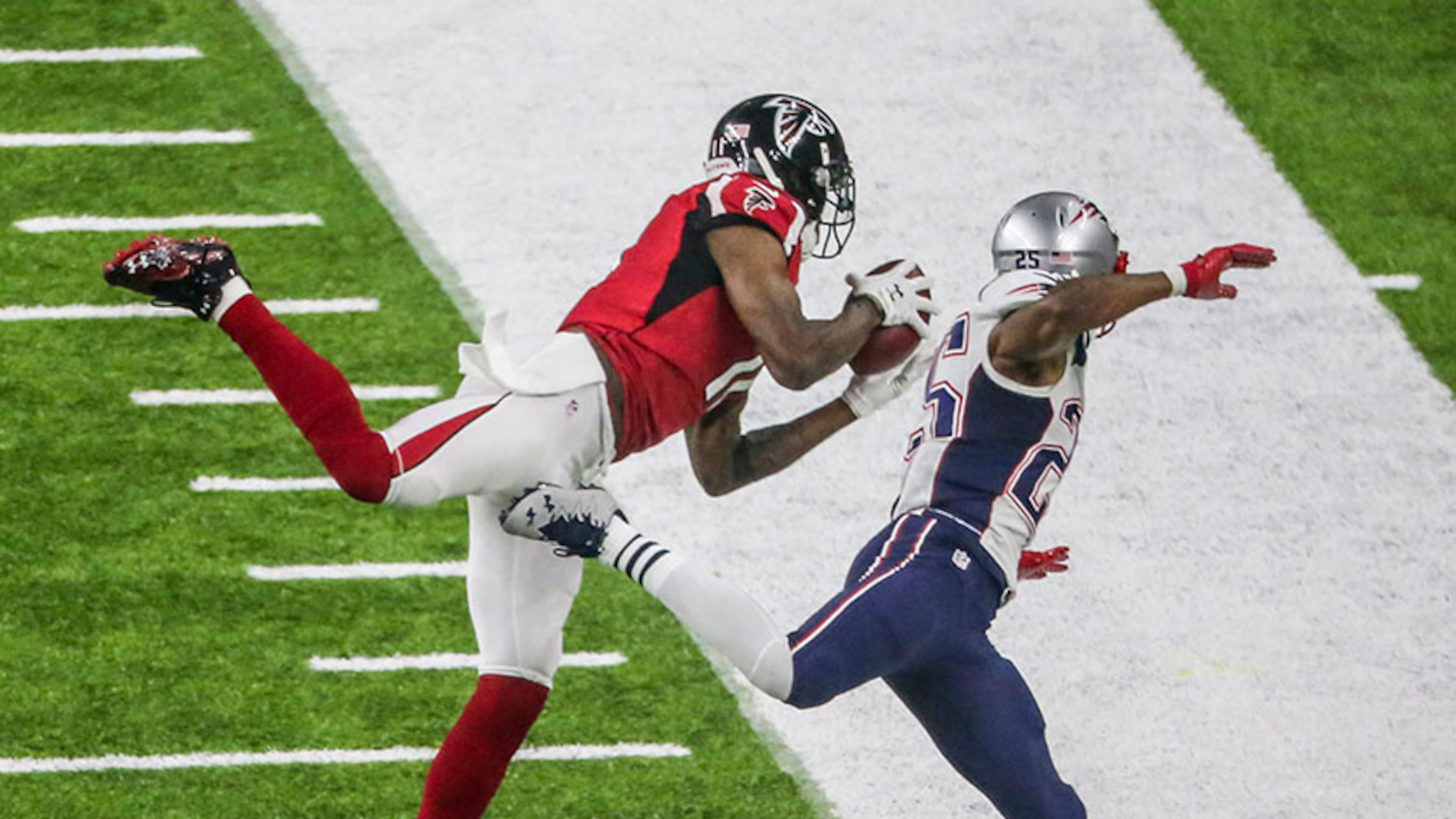 Julio Jones gets his first foot down as he makes an impressive catch over Patriots defender Eric Rowe during Super Bowl LI Feb. 5, 2017, at NRG Stadium in Houston.