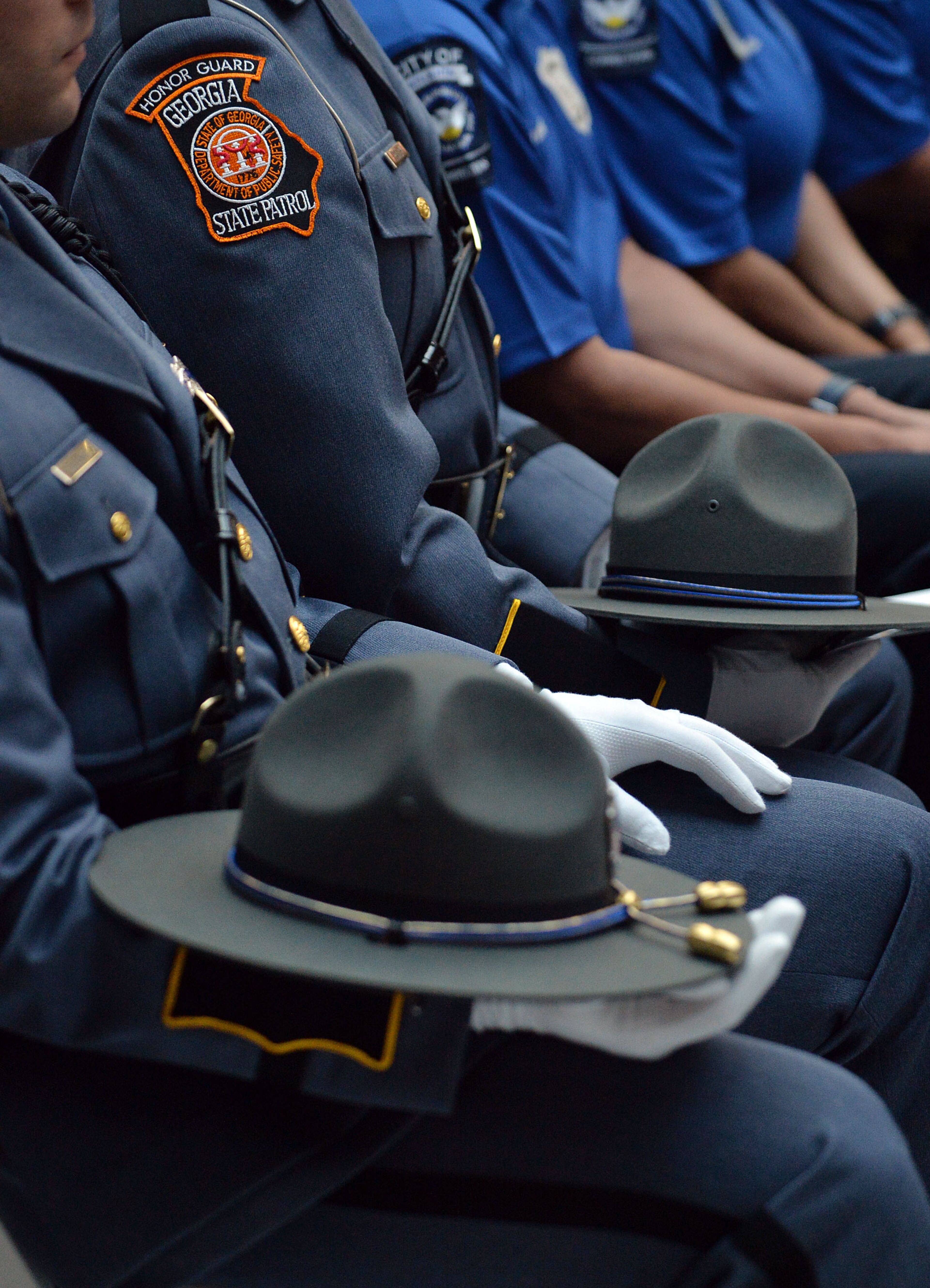 Members of several law enforcement agencies, including the Georgia State Patrol, attended the service, The Atlanta Police Department recognized 82 fallen officers during the 24th Annual Police Memorial Service at the Atlanta City Hall atrium, Tuesday, May 5, 2015. The Right Rev. Robert C. Wright of the Episcopal Diocese of Atlanta was the keynote speaker. Additional speakers included Atlanta Police Chief George N. Turner, Michael Geisler, Chief Operating Officer, City Council President Ceasar C. Mitchell and Council member C.T. Martin, Public Safety Chair. KENT D. JOHNSON /KDJOHNSON@AJC.COM