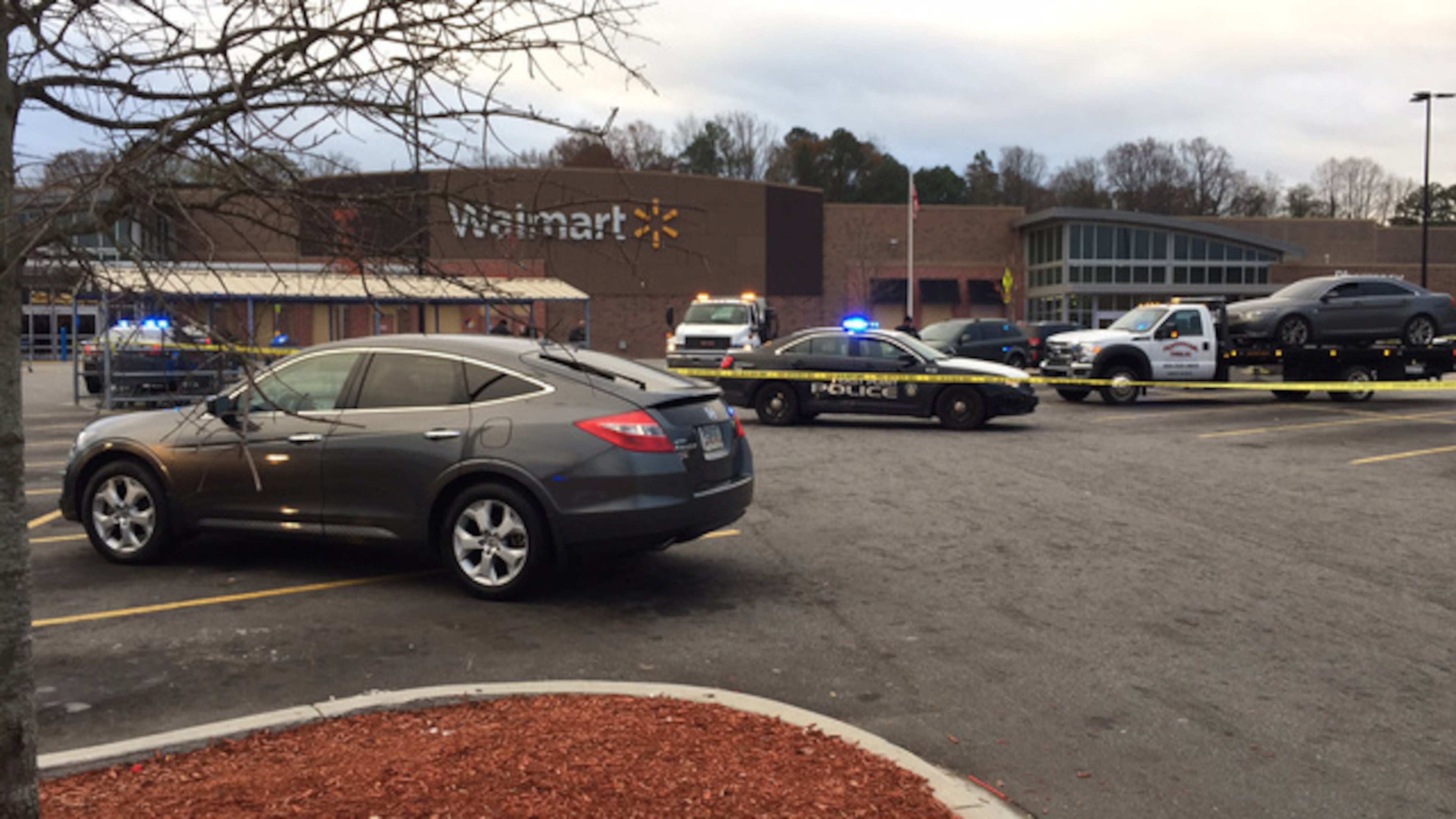 A man shot and killed a woman in a car and then shot and killed himself. The murder-suicide happened about 4 a.m. in the parking lot of the Wal-Mart located on Cleveland Avenue. (Credit: Channel 2 Action News)