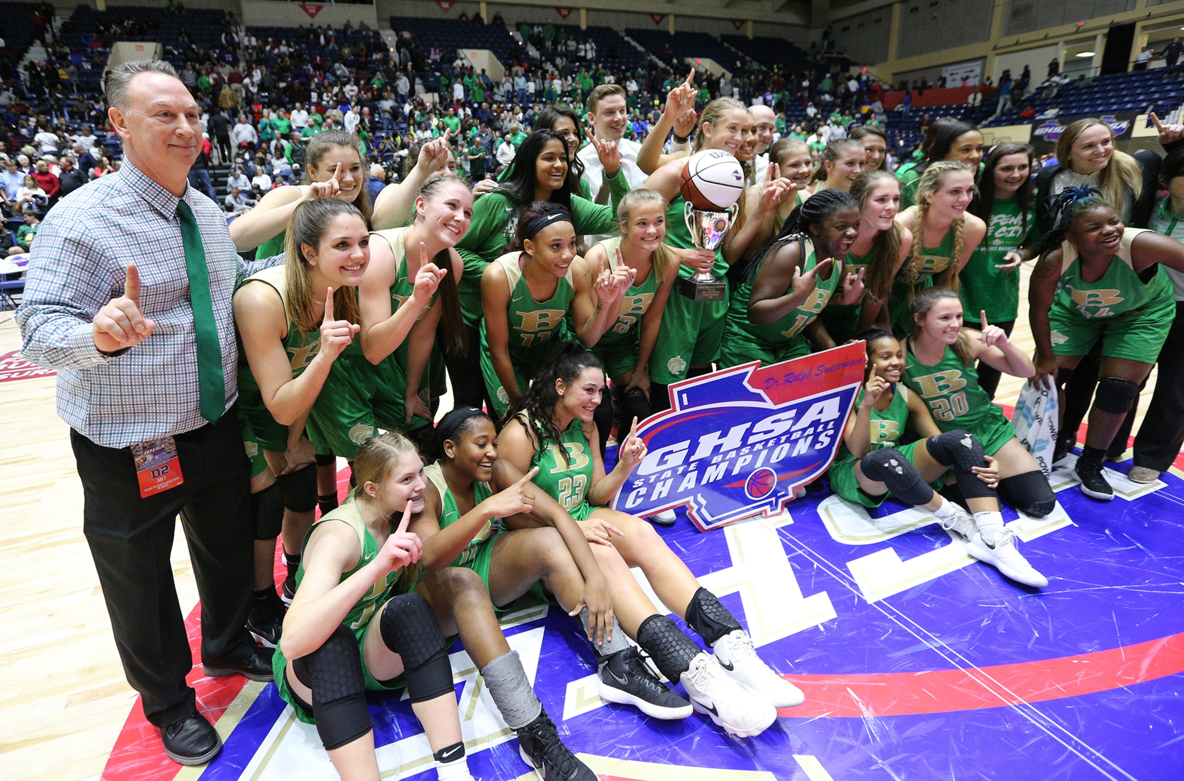 March 8, 2018 Macon: Buford gathers for a team photo during their trophy presentation after beating Flowery Branch 60-49 in their GHSA state basketball championship game on Thursday, March 8, 2018, in Macon. Curtis Compton/ccompton@ajc.com