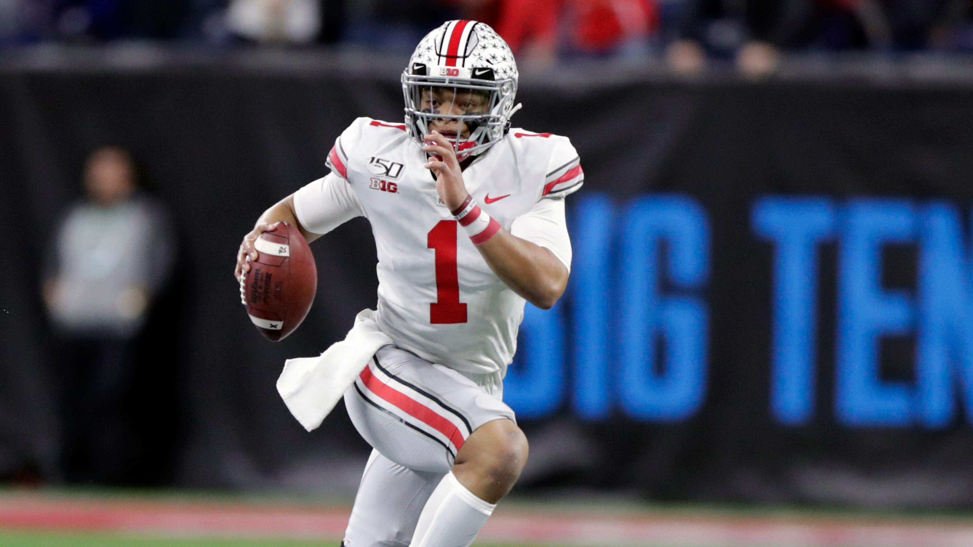 Quarterback Justin Fields won't be playing football for Ohio State this year after the Big Ten postponed the season because of the novel coronavirus pandemic. (AP Photo/Michael Conroy, File)