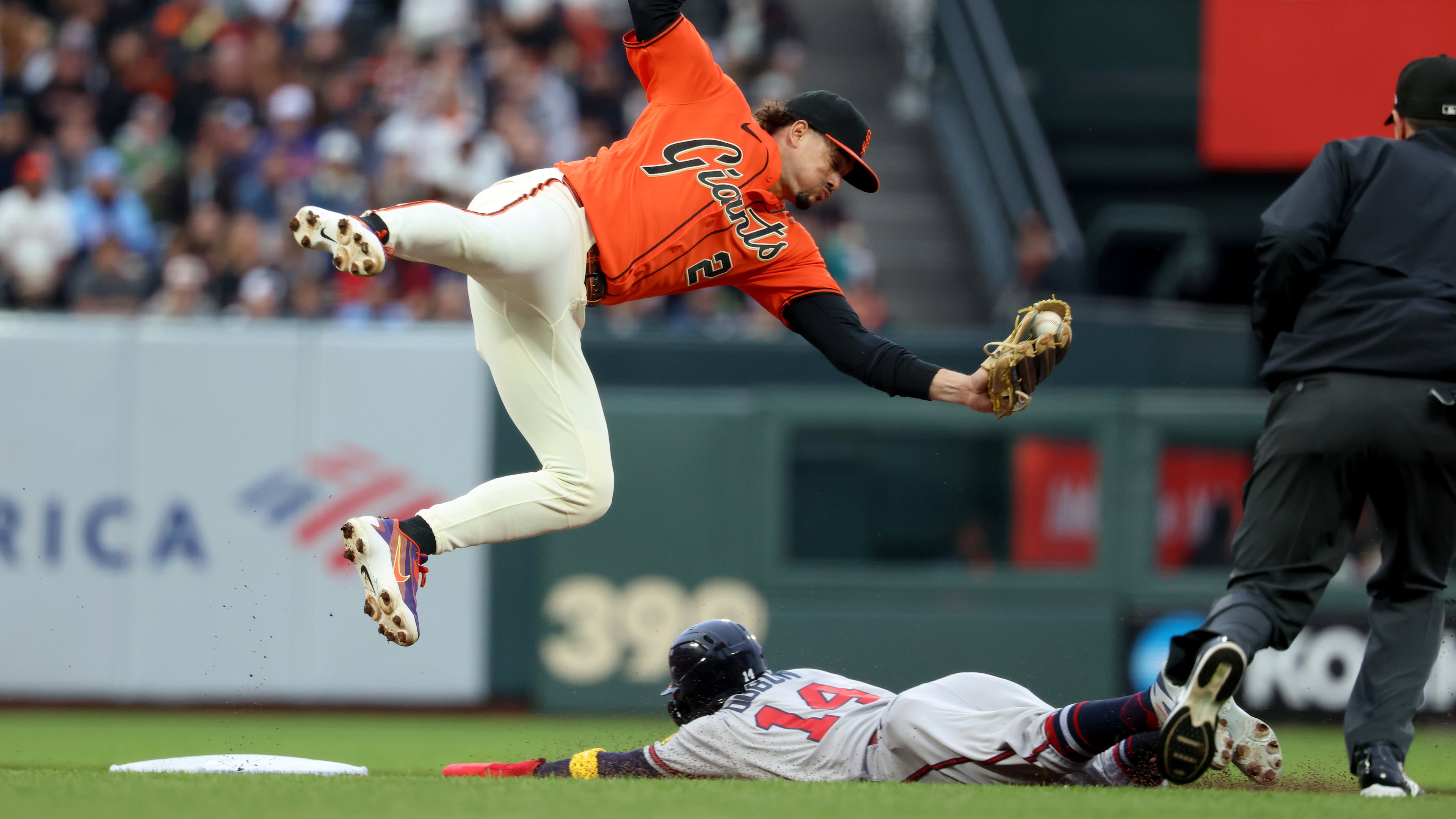 Atlanta Braves' Mauricio Dubón (on the ground) steals second base as San Francisco Giants shortstop Willy Adames fields the throw during the first inning of a baseball game in San Francisco, Friday, June 26, 2026. (Jed Jacobsohn/AP)