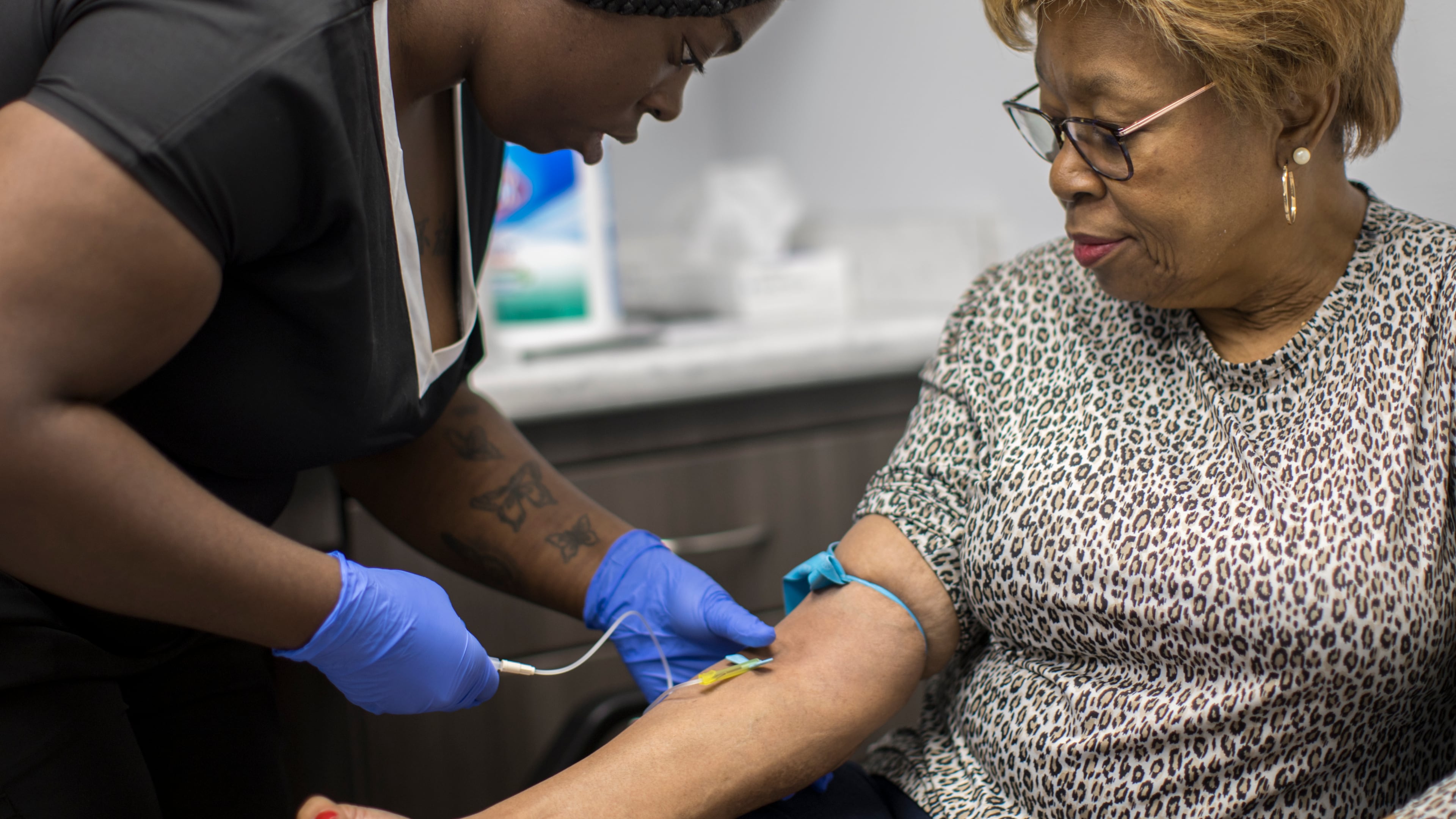 A phlebotomist working with Emory University takes a blood sample from Brunswick resident Etta Brown as part of a study by the college into potential long-term health effects of exposure to chemicals present in Superfund sites around the Brunswick area. The Emory researchers are analyzing blood samples for contaminants including lead, mercury, arsenic, cadmium and PCBs. (Stephen B. Morton/AJC)