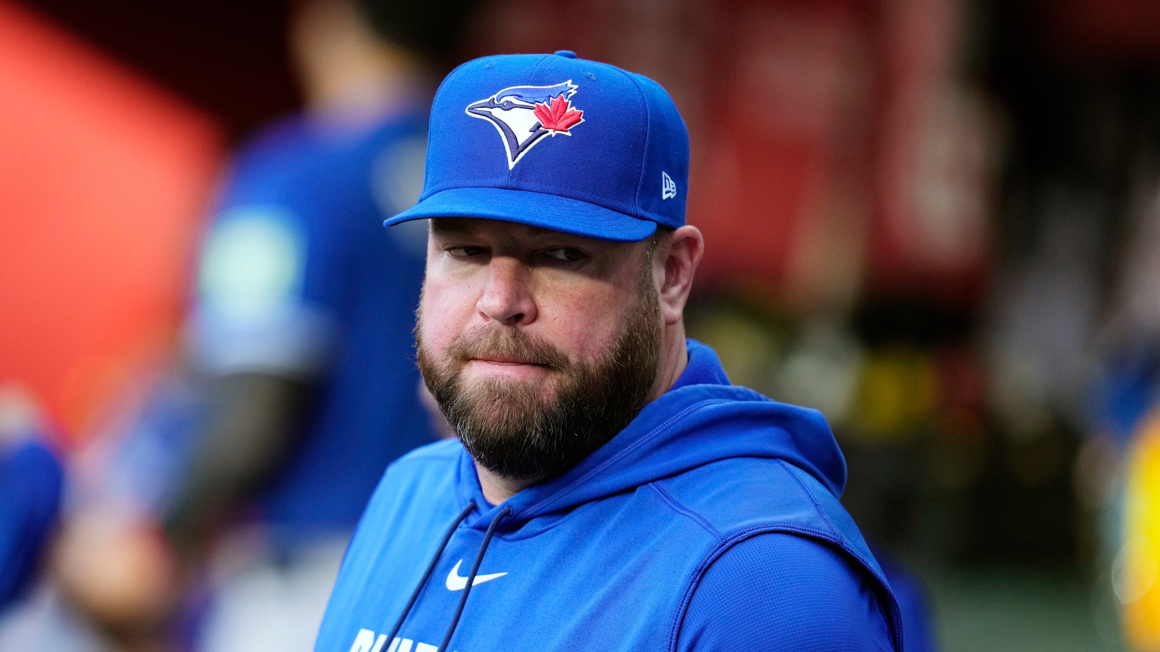 Toronto Blue Jays manager John Schneider pauses in the team dugout prior to a baseball game against the Arizona Diamondbacks, Saturday, April 18, 2026, in Phoenix. (AP Photo/Ross D. Franklin)
